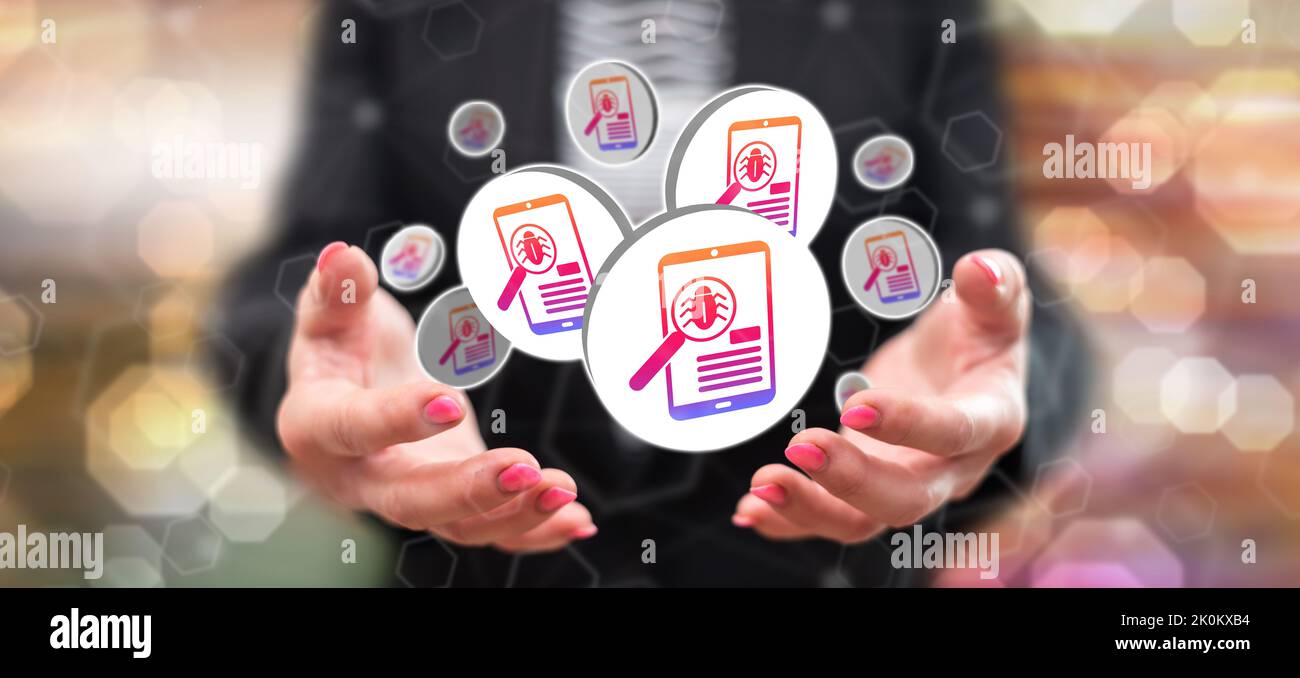 Software testing concept above the hands of a woman in background Stock Photo