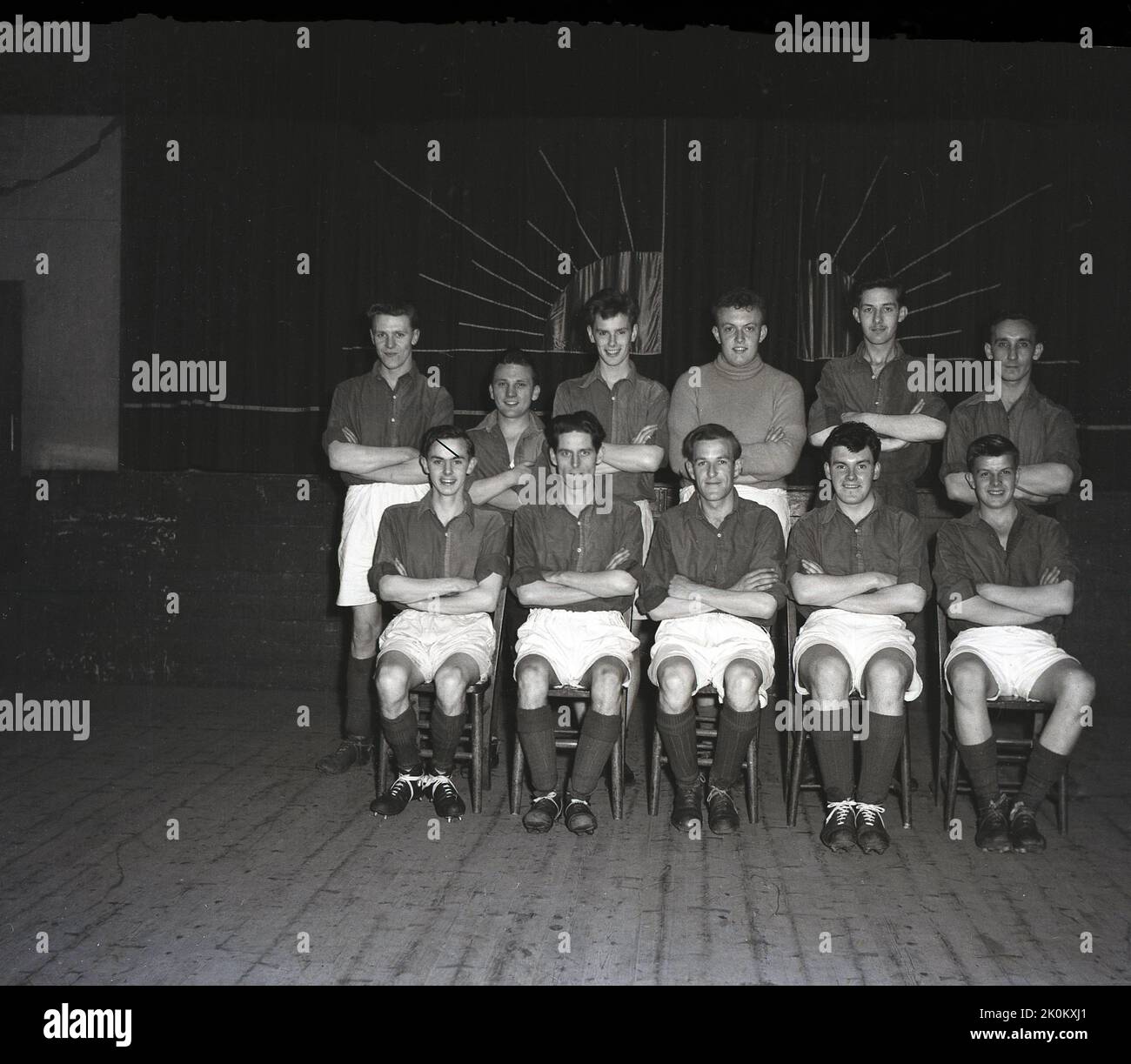 1956, historical, group photo in village hall of St Mary's football team with trophies, Leeds, England, UK. Stock Photo