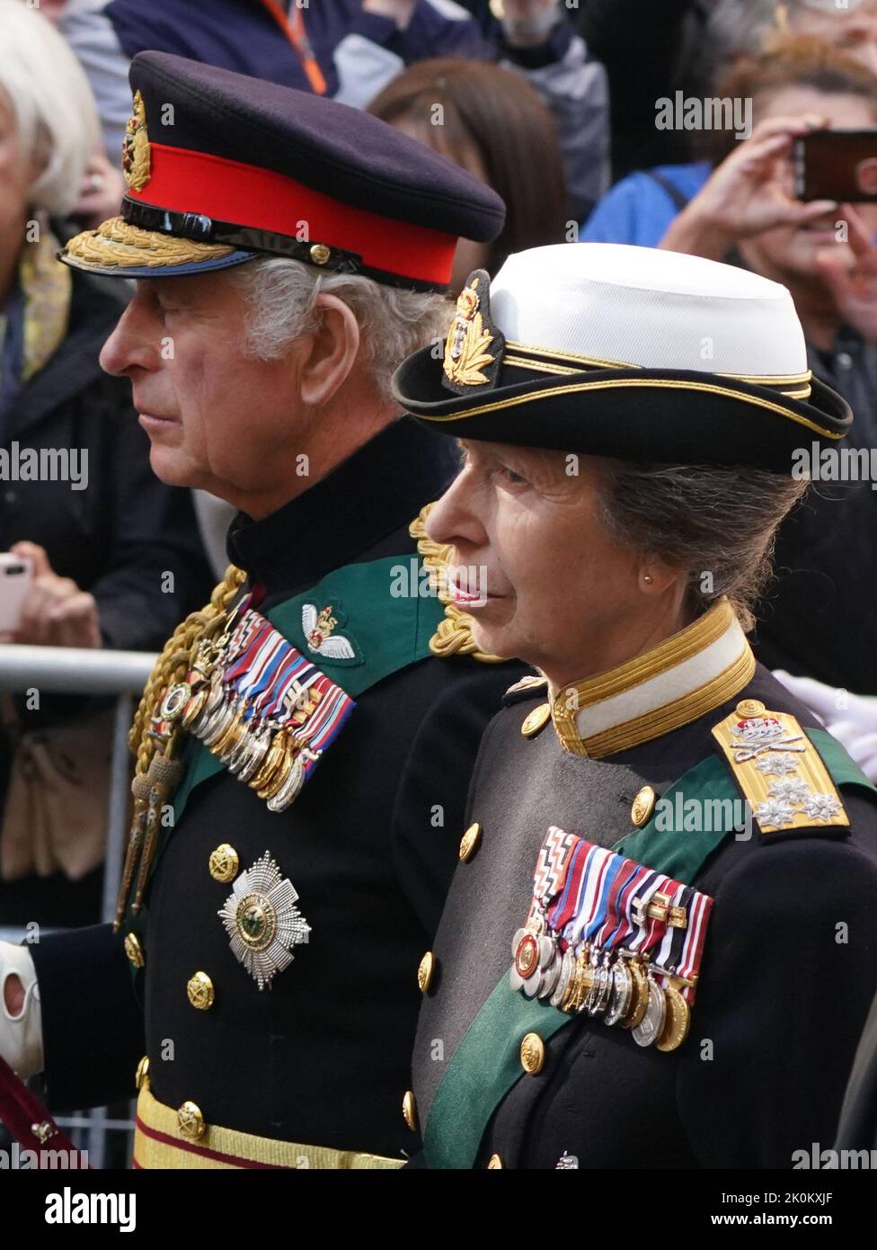 King Charles III and members of the royal family join the procession of