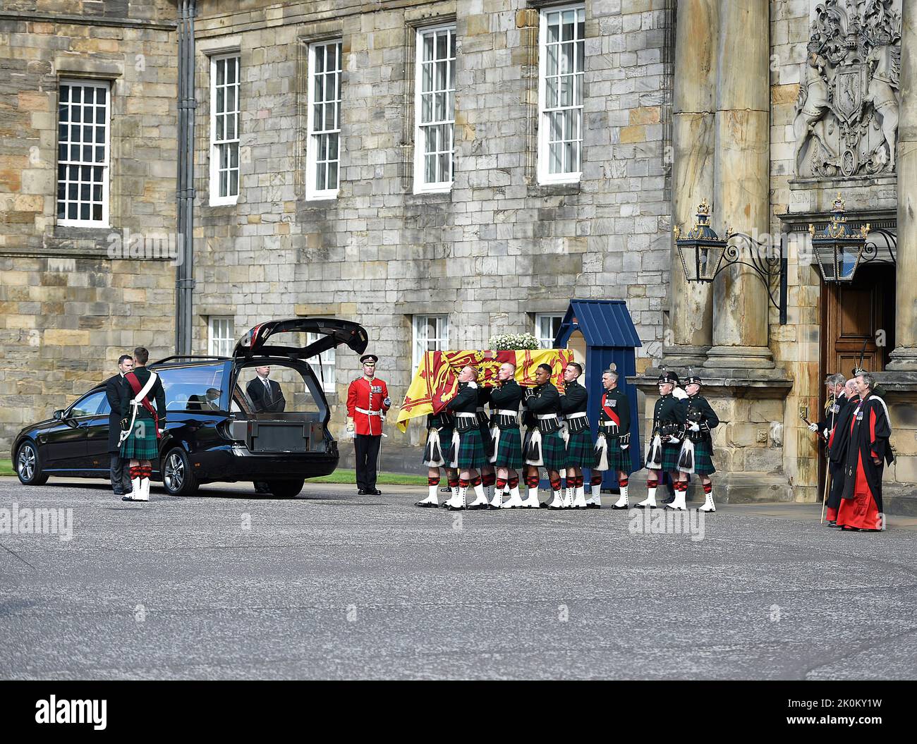Royal guards carry Queen Elizabeth II's coffin at the start of the