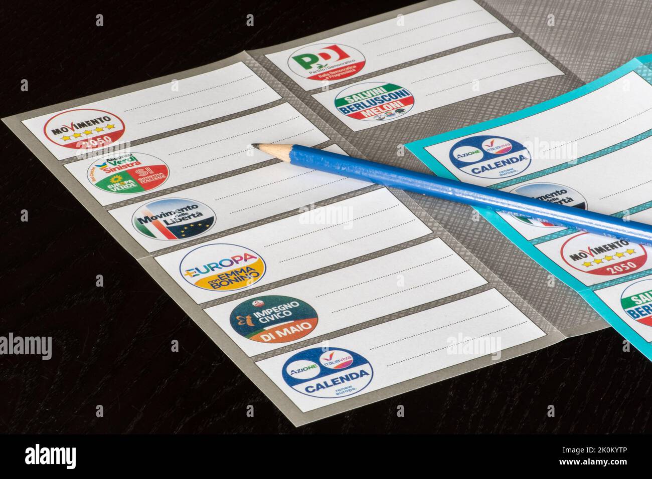 Italian general election 25 September 2022 for Chamber of Deputies and Senate of the Republic. Voting or ballot paper with party symbols and pencil Stock Photo