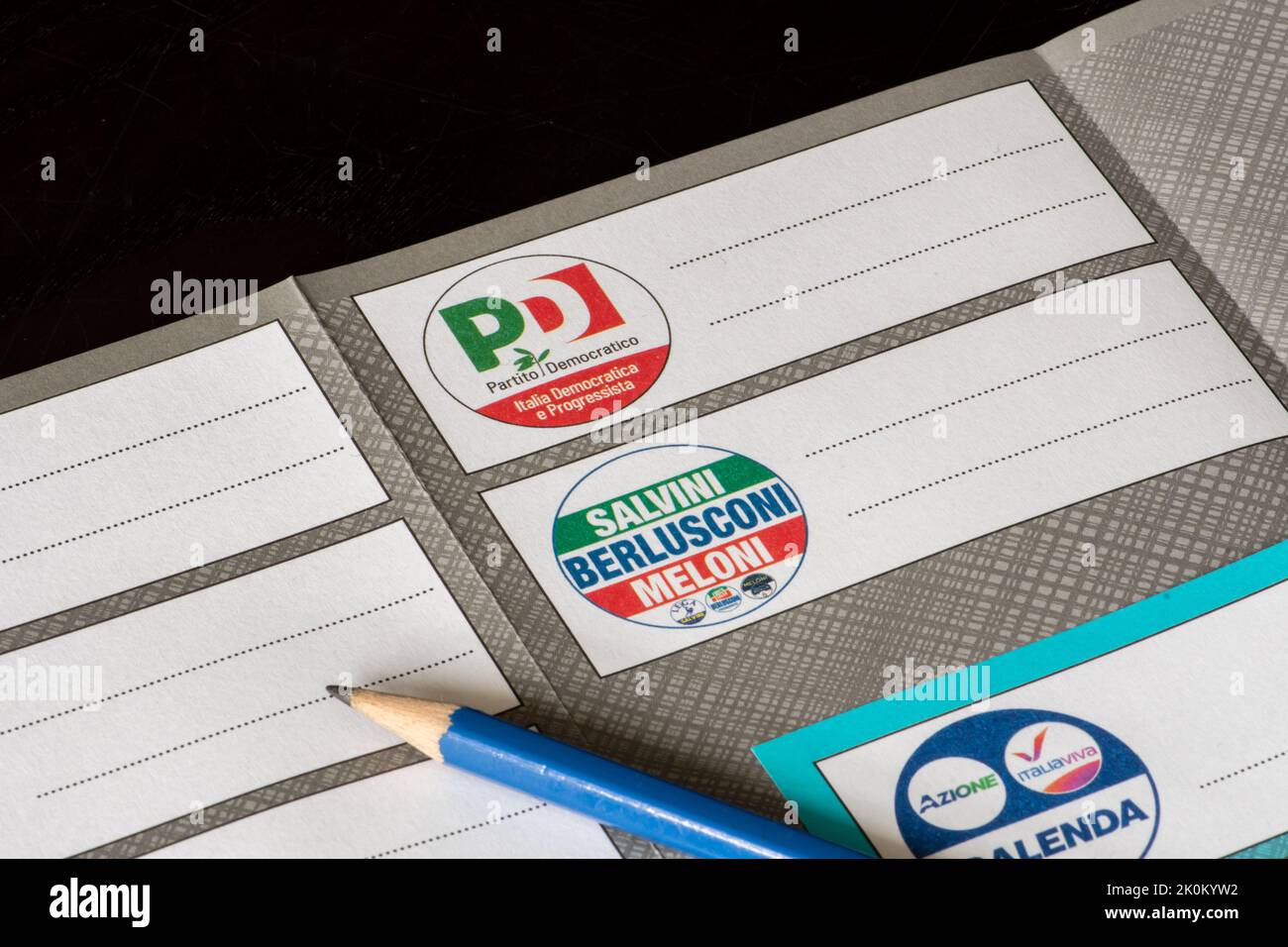 Italian general election 25 September 2022 for Chamber of Deputies and Senate of the Republic. Voting or ballot paper with party symbols and pencil Stock Photo