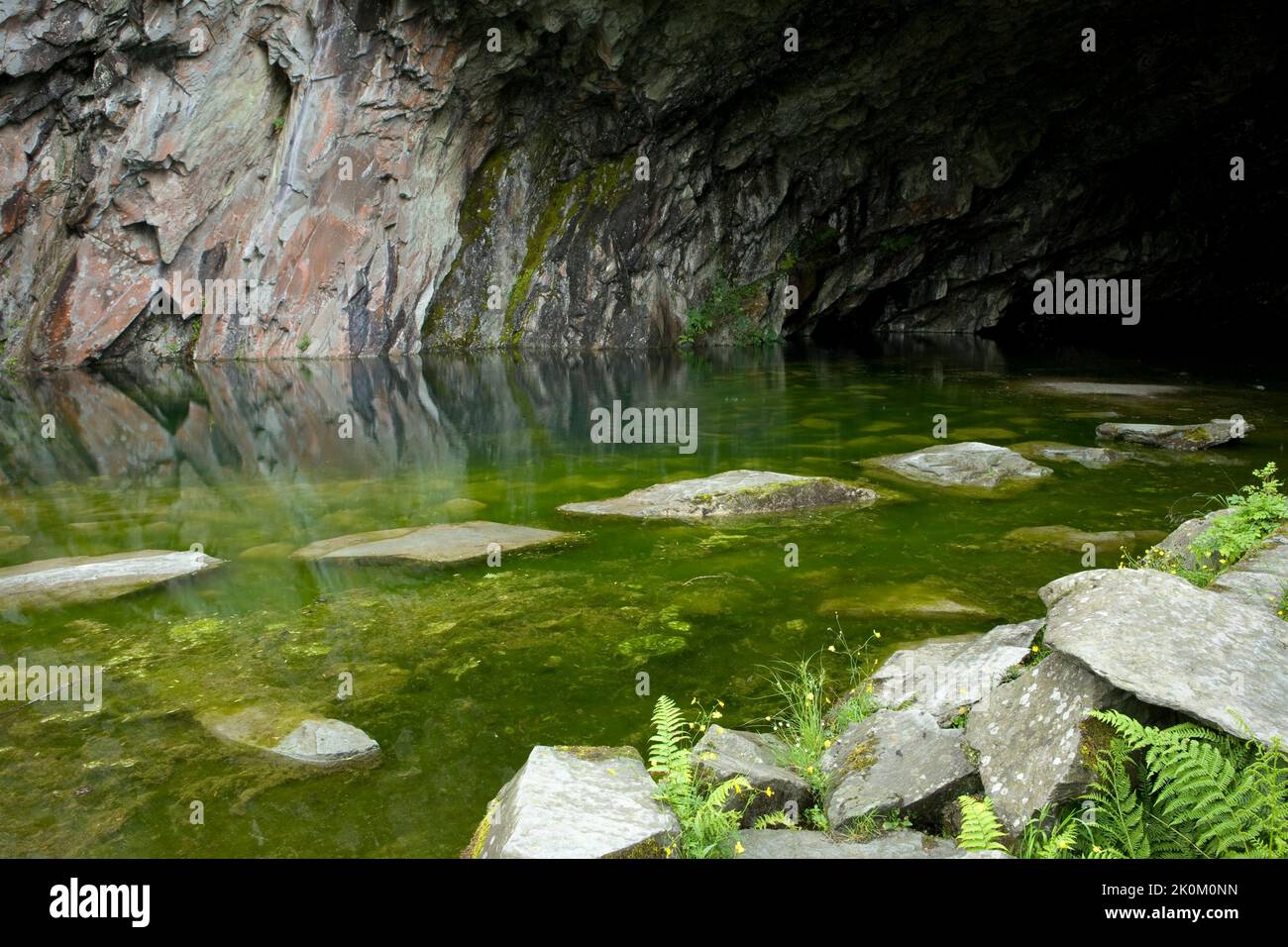 A cave, part of a disused slate quarry, by Rydal Water in the Lake District, England, UK Stock Photo