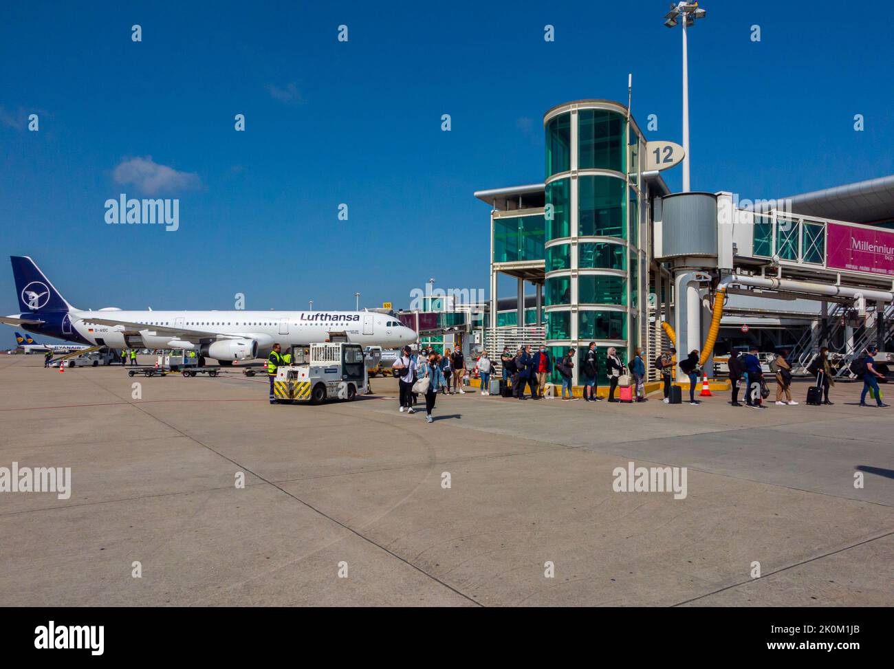 Passengers on tarmac next to a Lufthansa airbus aircraft at Porto airport in Portugal. Stock Photo