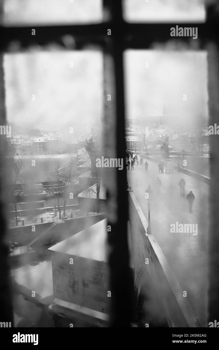 Monochrome picture of Prague in the winter showing snow on a bridge Stock Photo