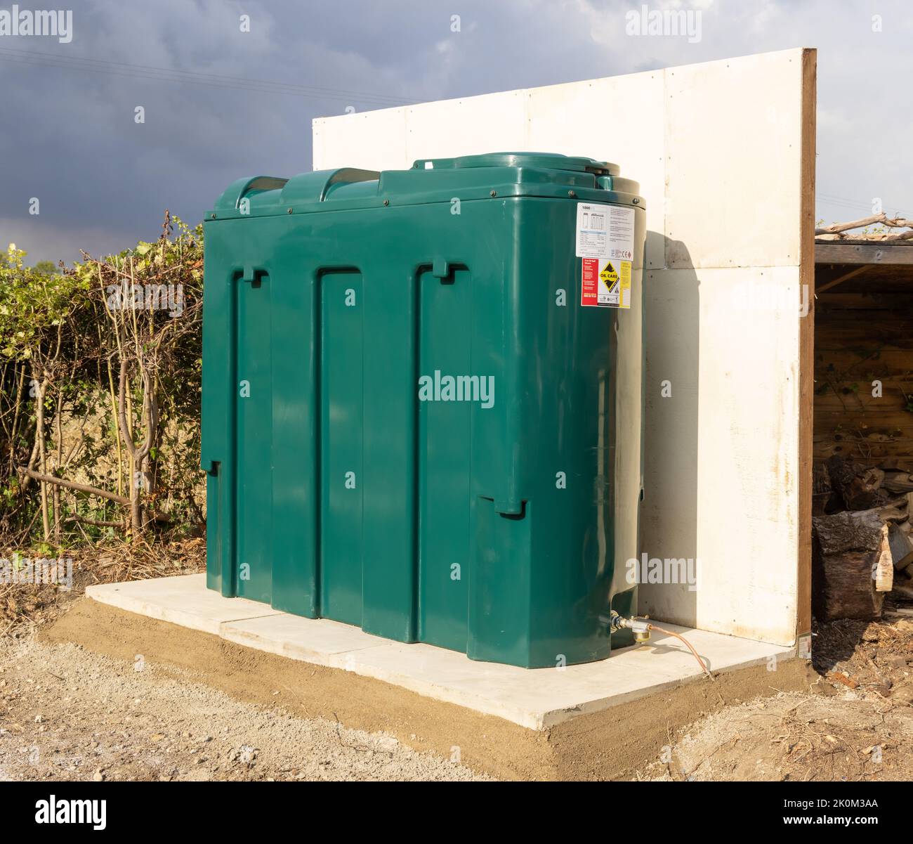Newly installed domestic bunded 1000 litre heating oil tank with fire