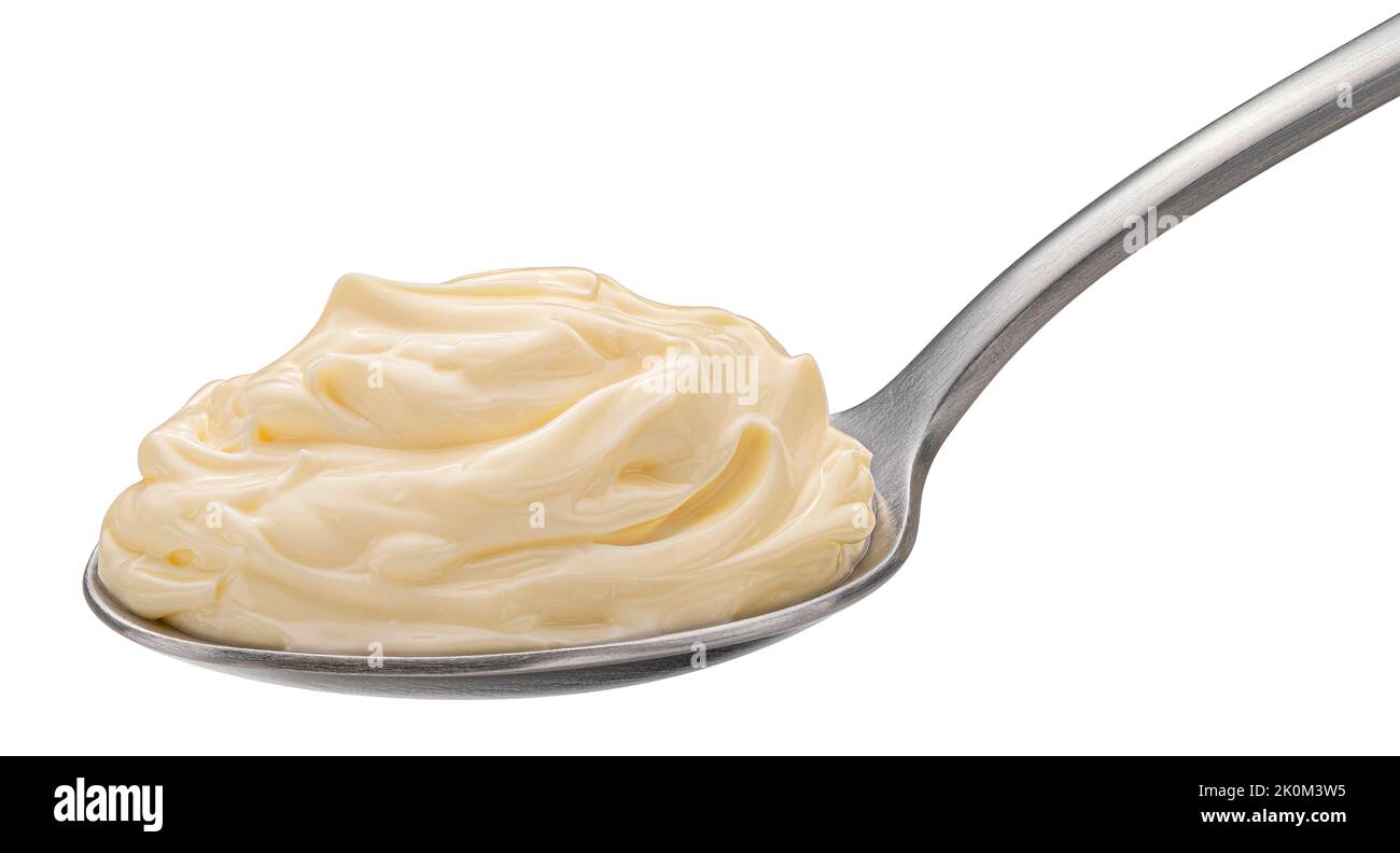 Mayonnaise in spoon isolated on white background Stock Photo