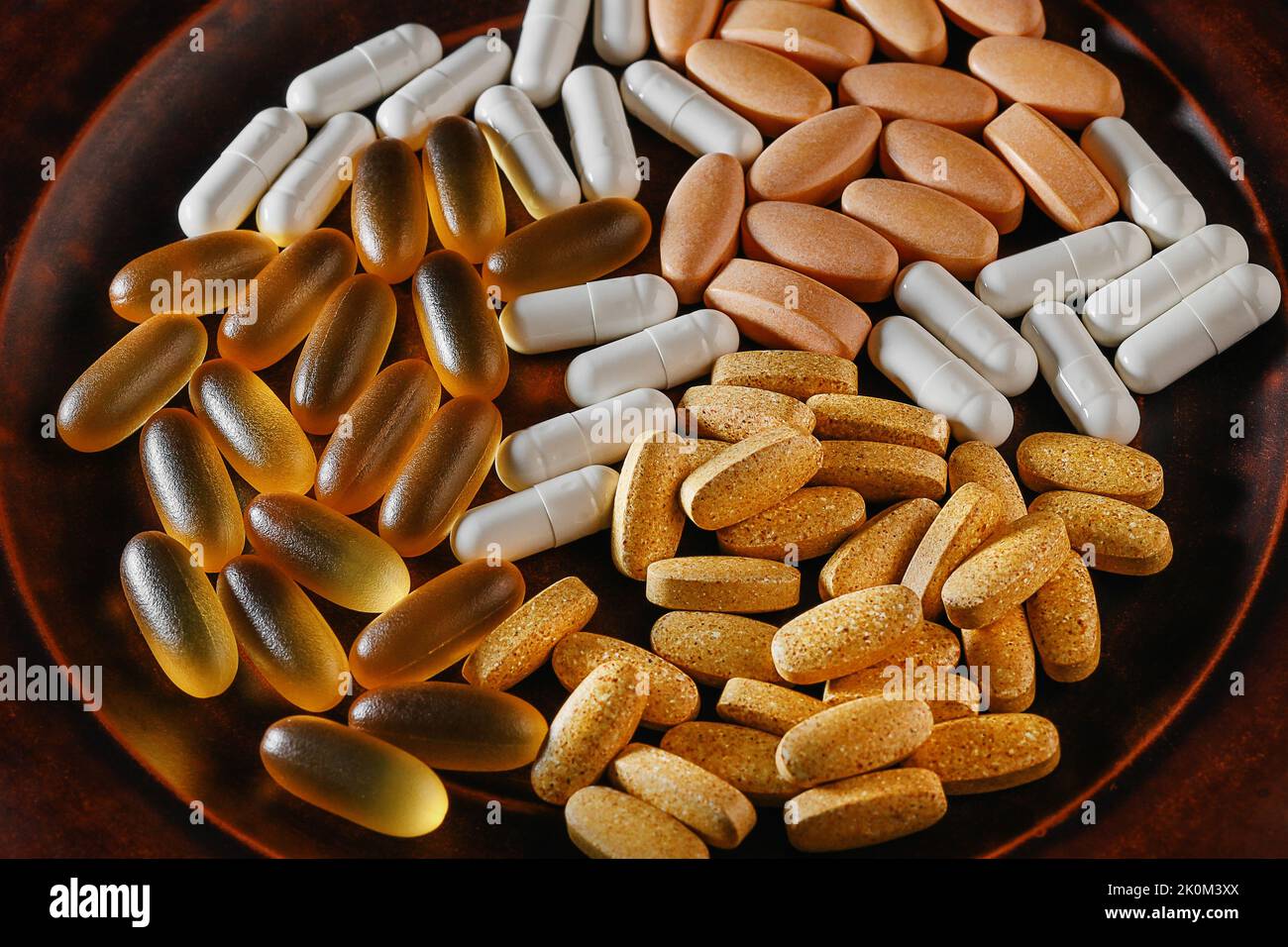 pills top view. magnesium taurate, monolaurin, ultra omega3 and