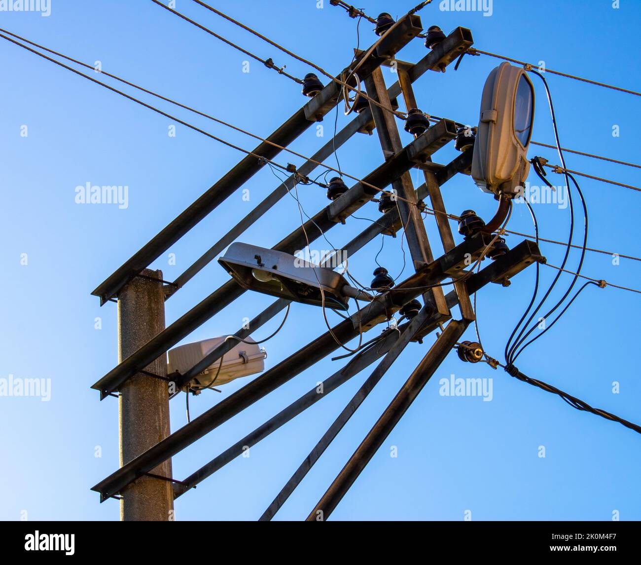 Metal electric pole. Electric wires. street lighting Stock Photo