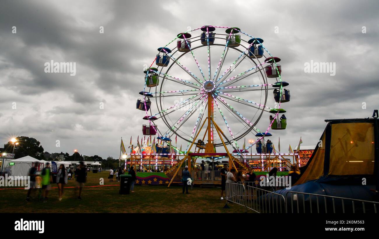 NORWALK, CT, USA - SEPTEMBER 11, 2022: Evening atmosphere from Oyster festival in Norwalk with colorful ride Stock Photo