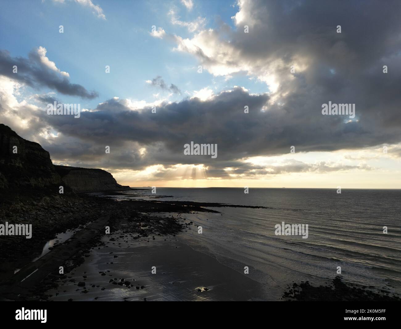 An aerial view of a sandy beach and scenic clouds above the beach Stock ...