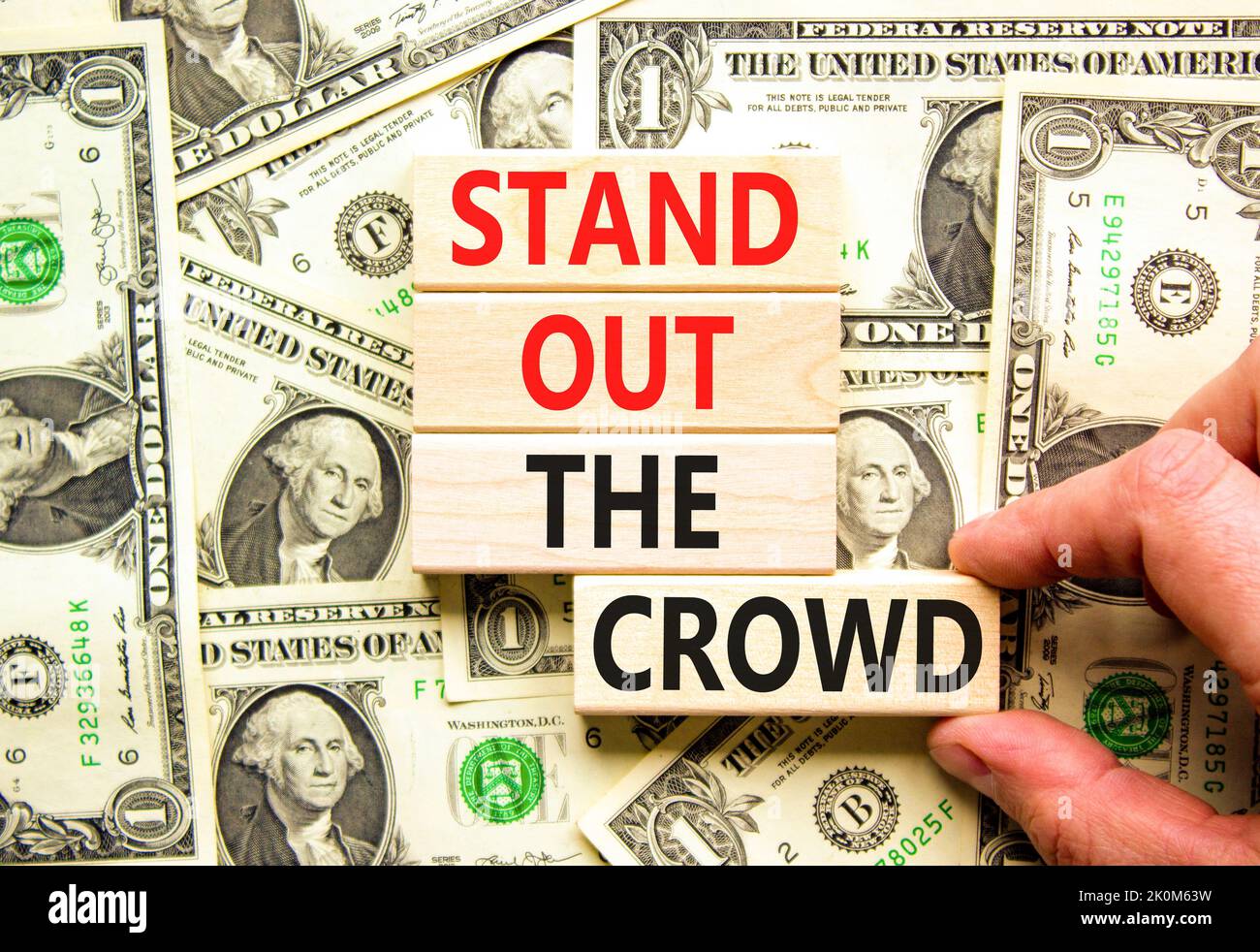 Stand out the crowd symbol. Concept words Stand out the crowd on wooden