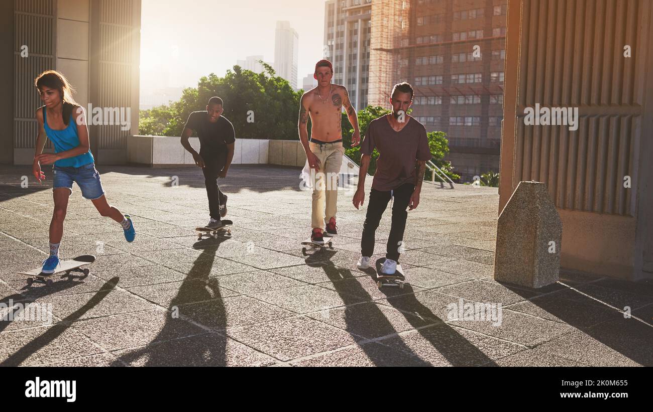 Skating is fun. a group of skaters skating in the city. Stock Photo