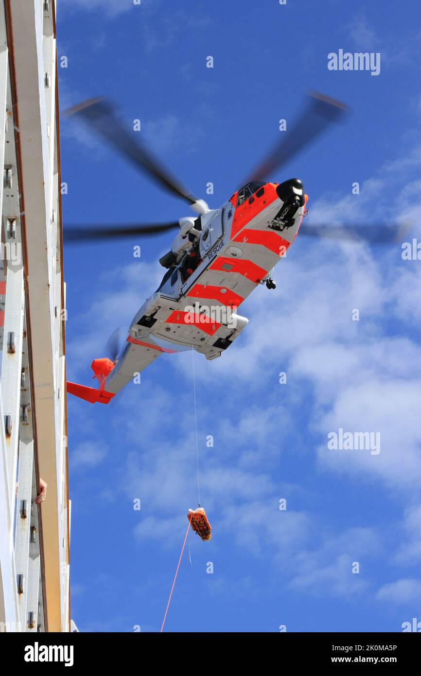 Emergency Marine evacuation by helicopter from a cruise ship in the North Sea Stock Photo