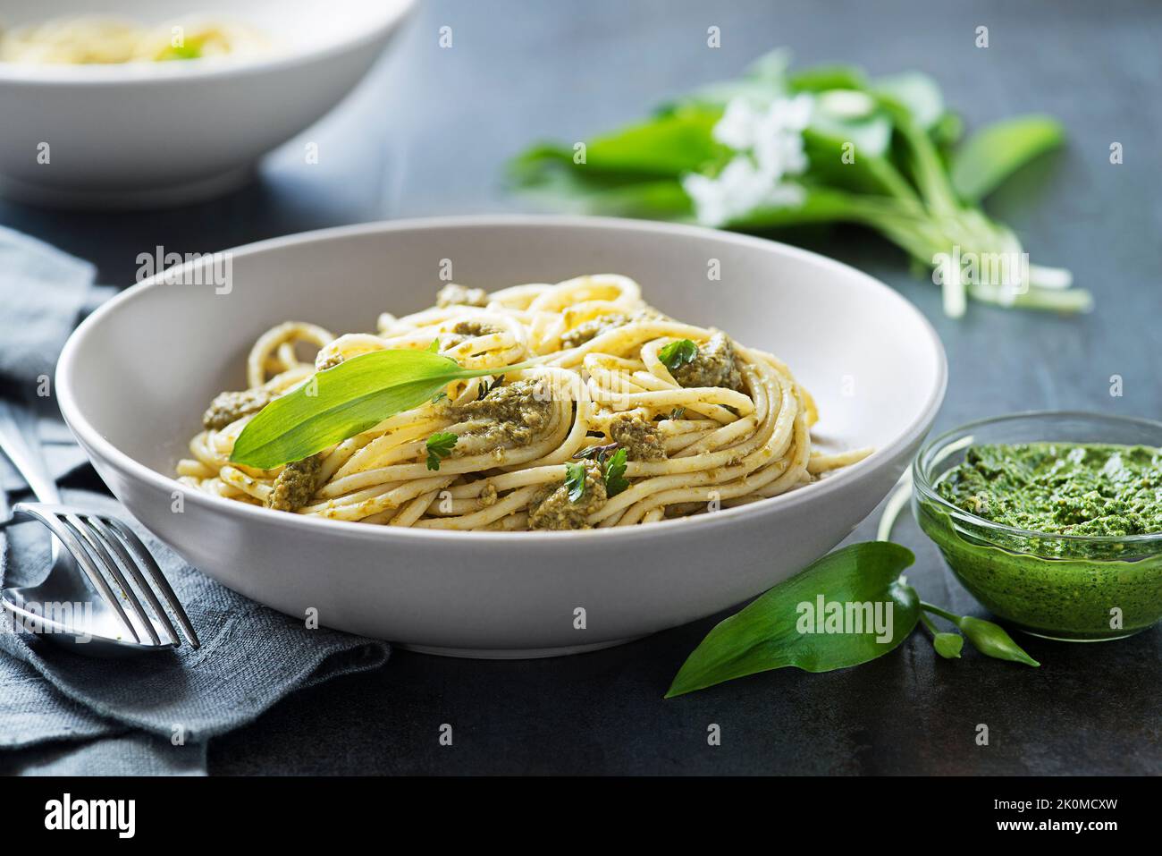 Making Fresh pasta with ramson or wild garlic pesto closeup. Healthy spring food concept Stock Photo