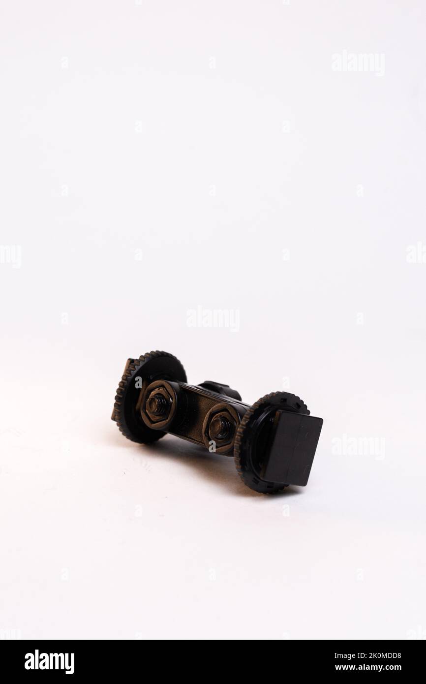 black plastic mount hot shoe for the camera is isolated on a white