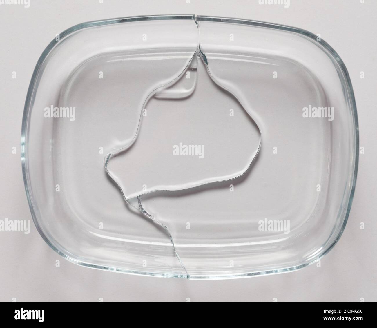 Cracked transparent glass bowl  above top view isolated on studio background Stock Photo