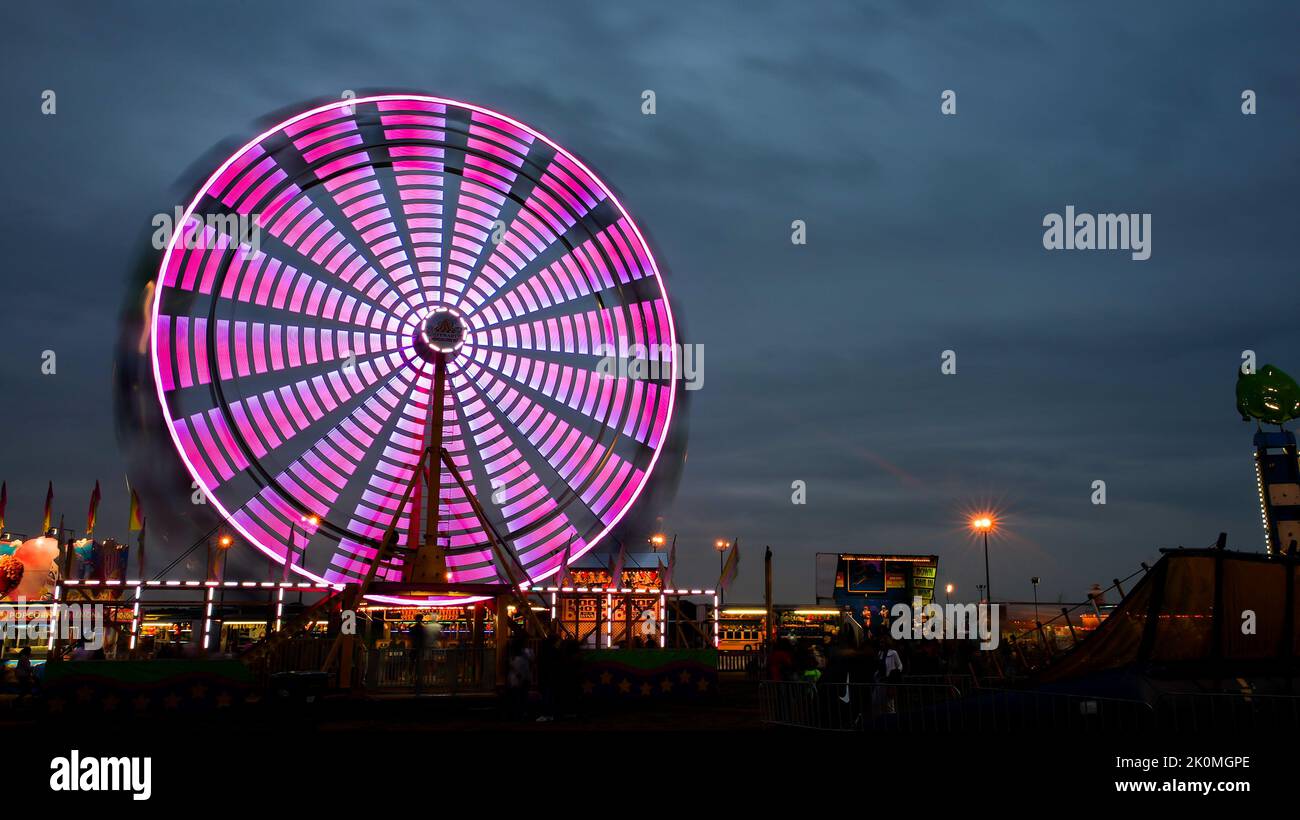 NORWALK, CT, USa - SEPTEMBER 11, 2022: Evening atmosphere from Oyster festival in Norwalk with colorful ride Stock Photo