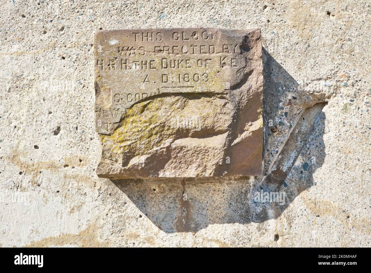 Very worn cornerstone commemorating the commission of a new Town Clock in 1803 by the Duke of Kent in Halifax Nova Scotia. Stock Photo