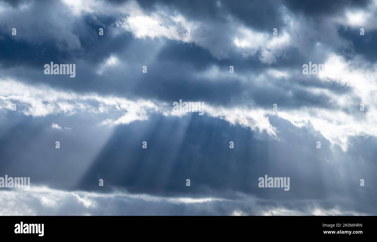 Dramatic cloudscape with sun beams Stock Photo