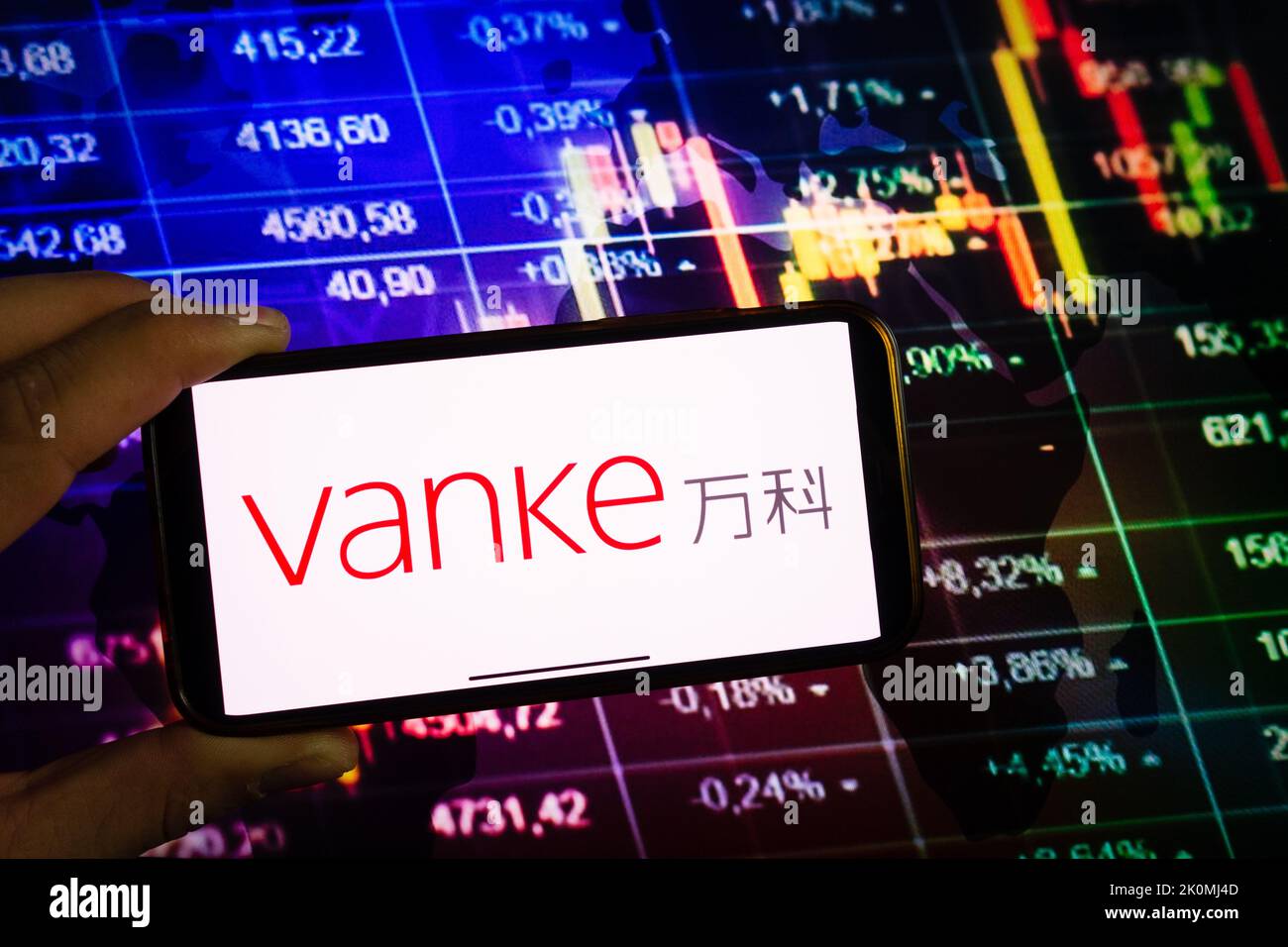 KONSKIE, POLAND - September 10, 2022: Smartphone displaying logo of Vanke company on stock exchange diagram background Stock Photo