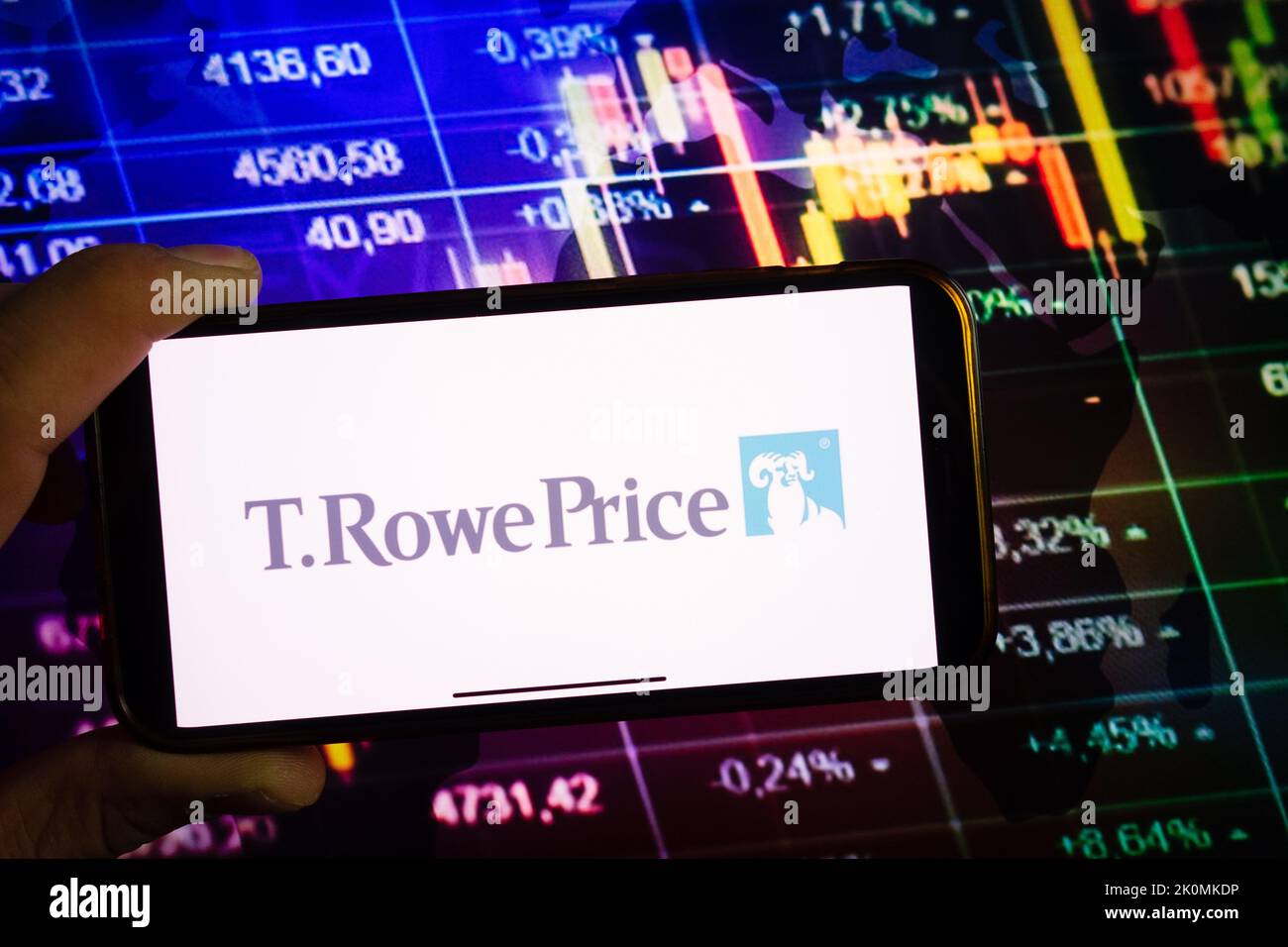KONSKIE, POLAND - September 10, 2022: Smartphone displaying logo of T. Rowe Price company on stock exchange diagram background Stock Photo