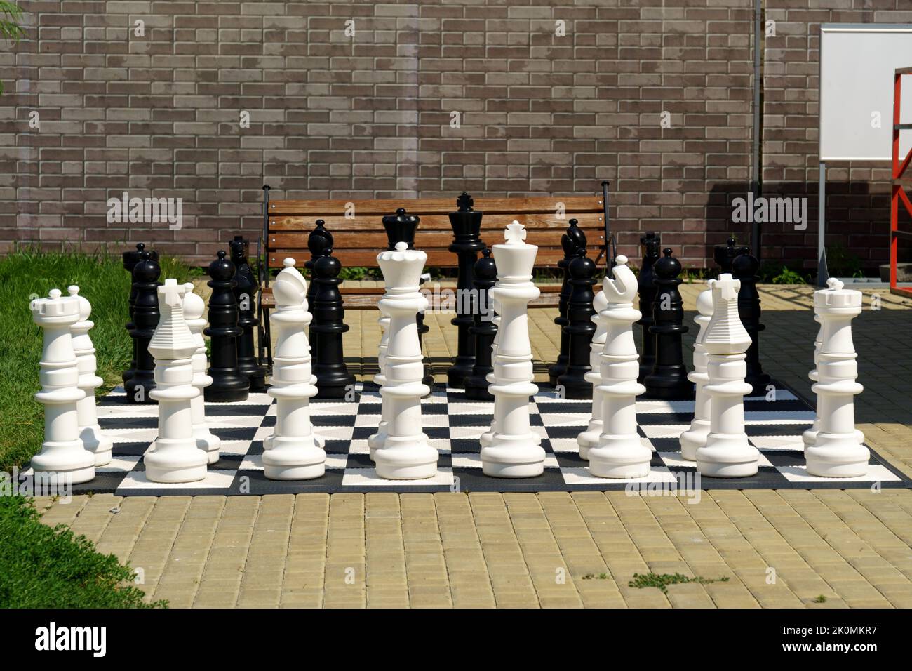 Giant garden chess set set out for a game of chess giant chess board. Selective focus Stock