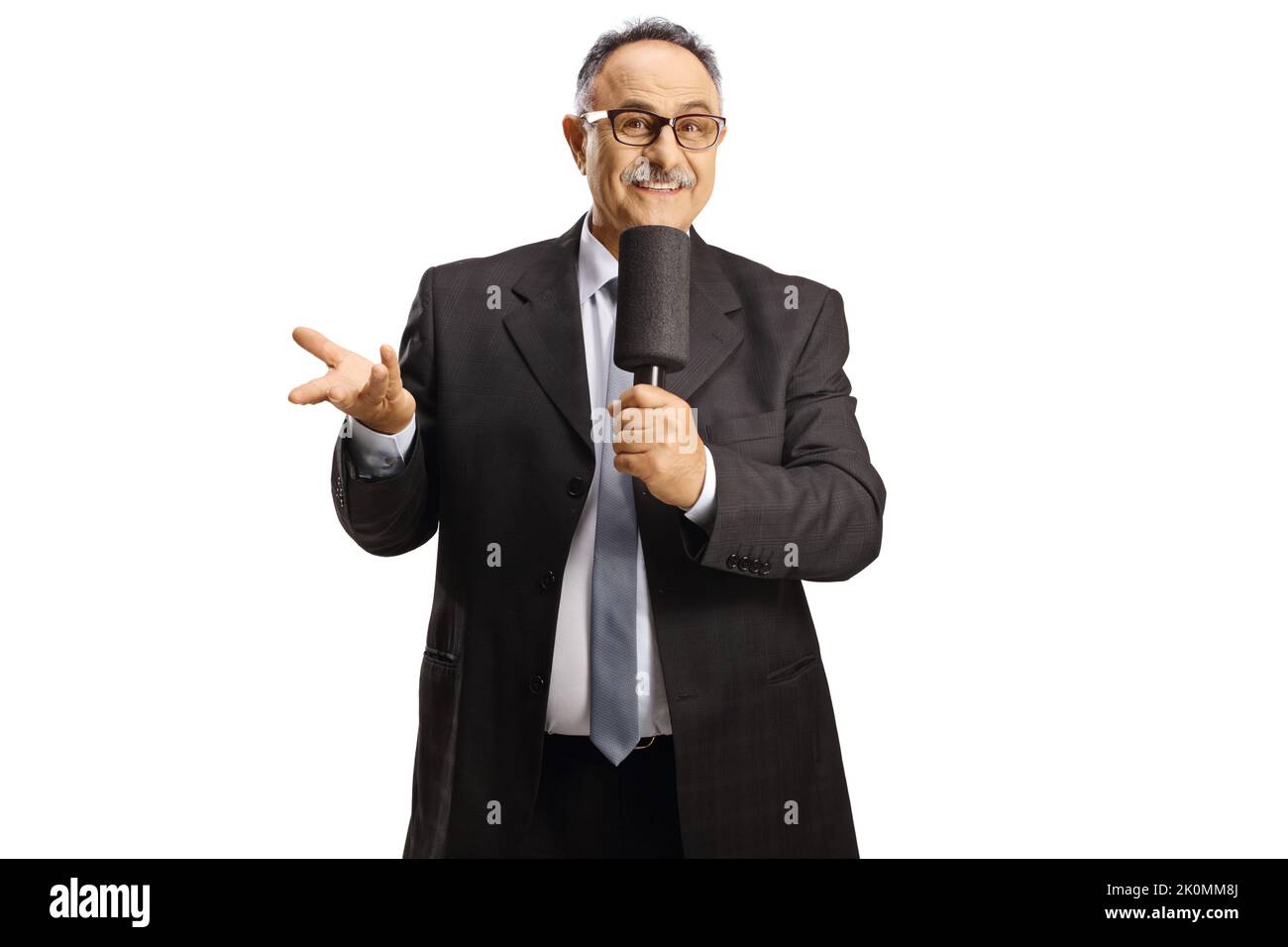 Mature male tv host with a microphone isolated on white background ...
