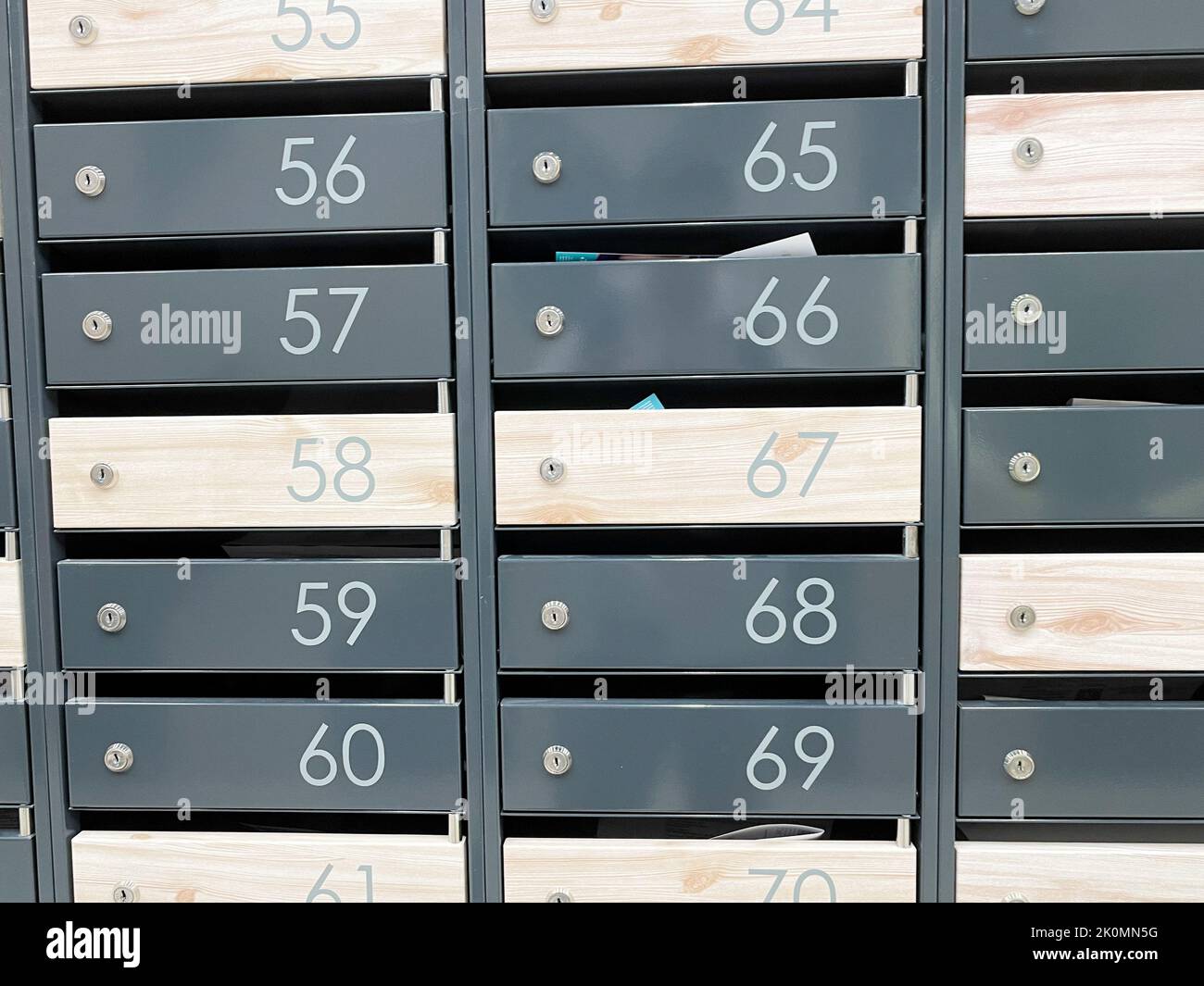Metal mailboxes with numbers. Apartment numbers on mailboxes Stock