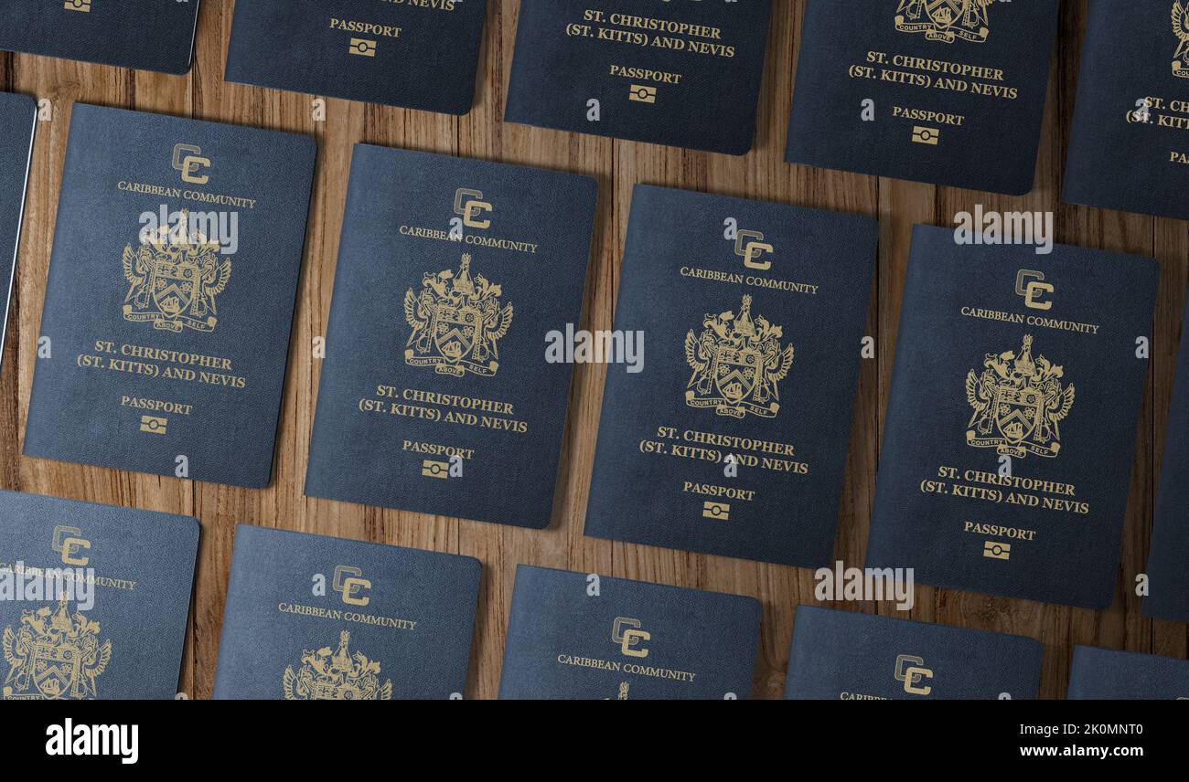 Passport Saint Kitts and Nevis, Passports of the Caribbean state of Saint Kitts and Nevis, top view, on a wooden table Stock Photo