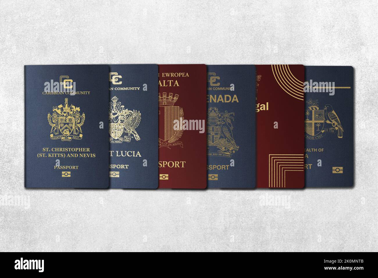 Top View, International Passports, citizenship by Investment, Nationality, Malta, Kitts and Nevis, Portugal,grenada, Dominica, Saint Lucia On a concre Stock Photo