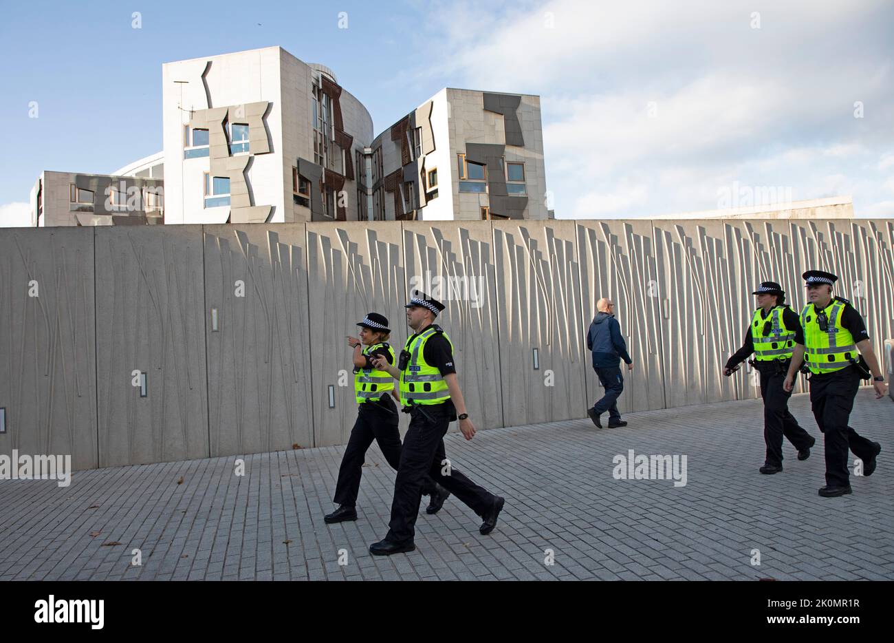 Holyrood, Edinburgh, Scotland, UK. 12th September 2022. Security for King Charles 111 at Scottish Parliament and  Holyrood Palace. Pictured: Police officers at Scottish Parliament building. Credit: Arch White/alamy live news. Stock Photo