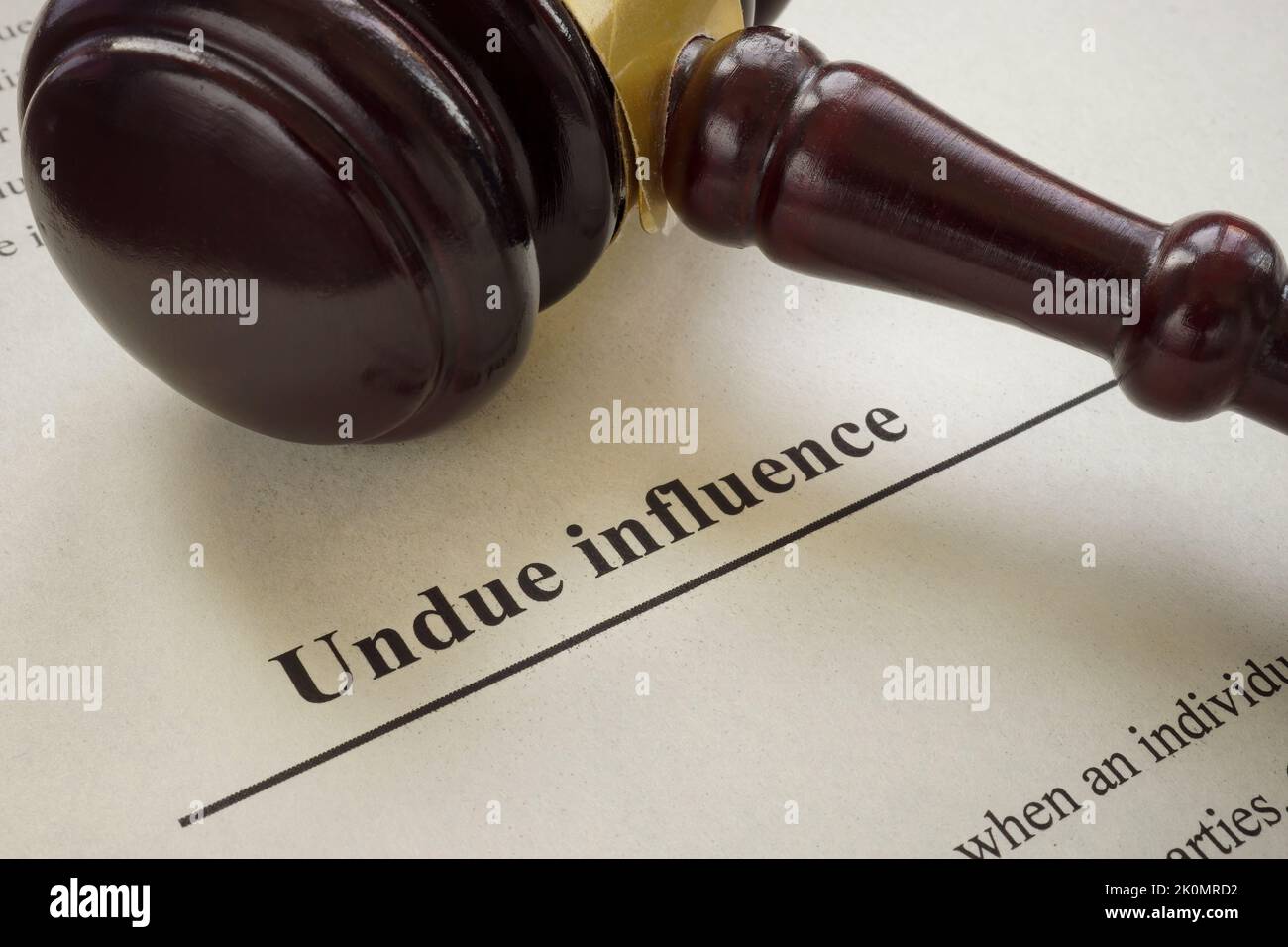 Info about undue influence and gavel near. Stock Photo