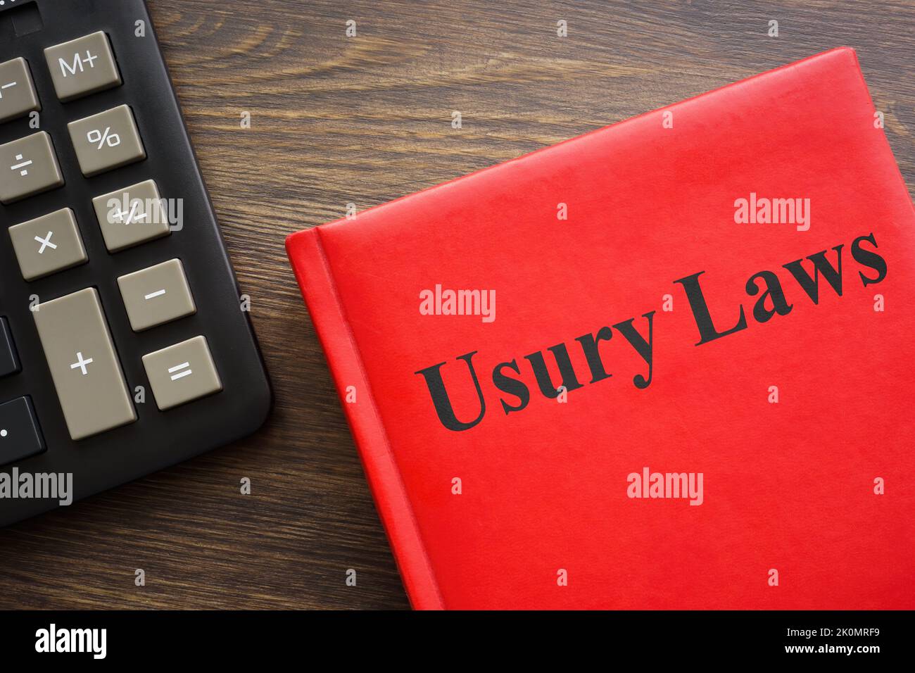 Usury laws book near a dark calculator. Stock Photo