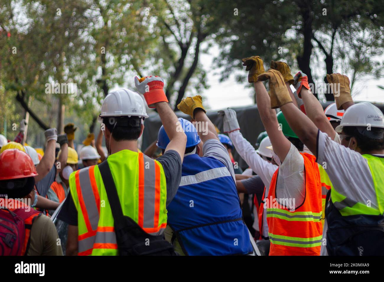 Volunteer doing the silence sign during rescue operations. In 2017, an ...