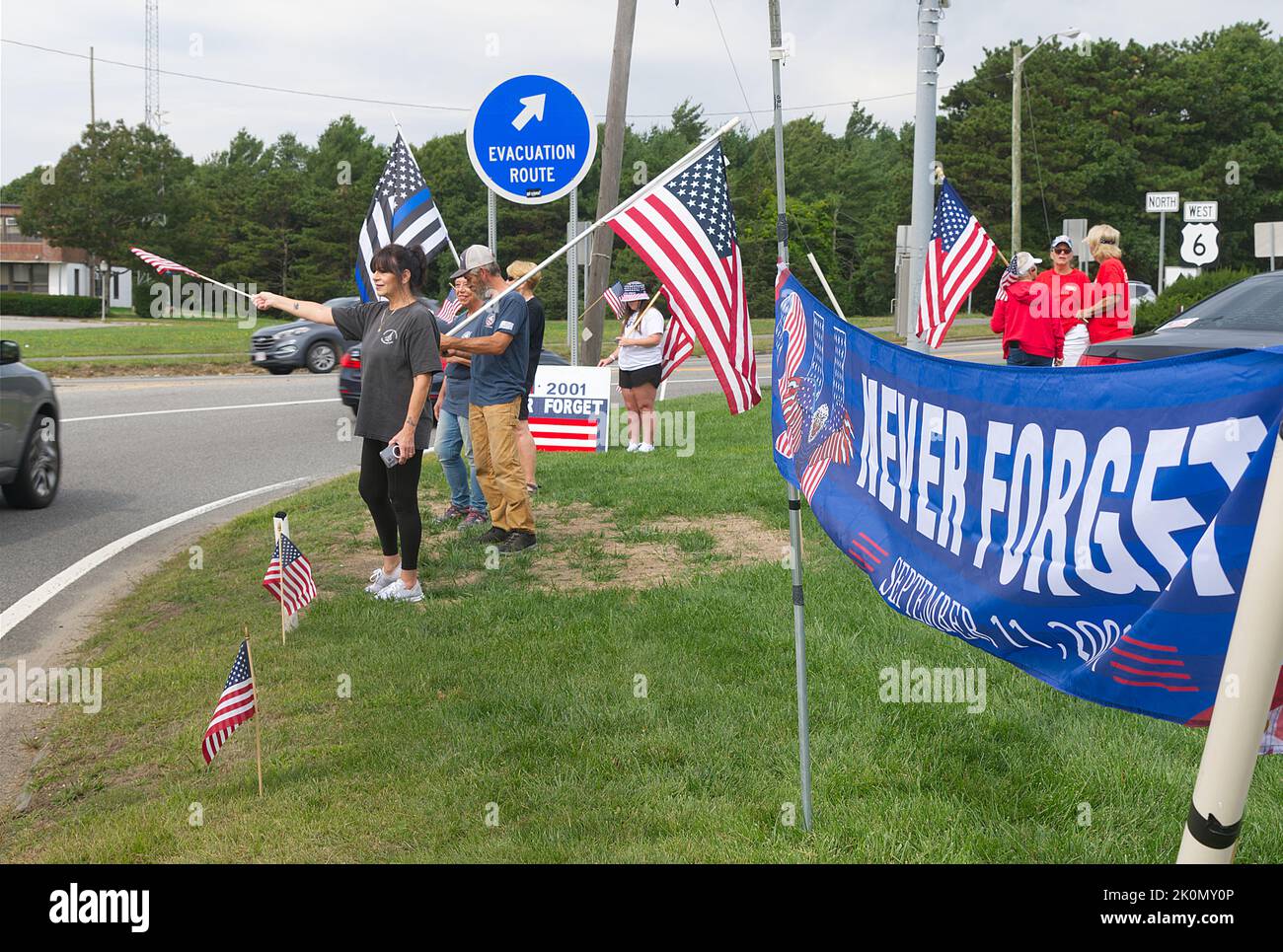 Remembering September 11th - flag waving at the Bourne Rotary on Cape Cod, Massachusetts, USA Stock Photo