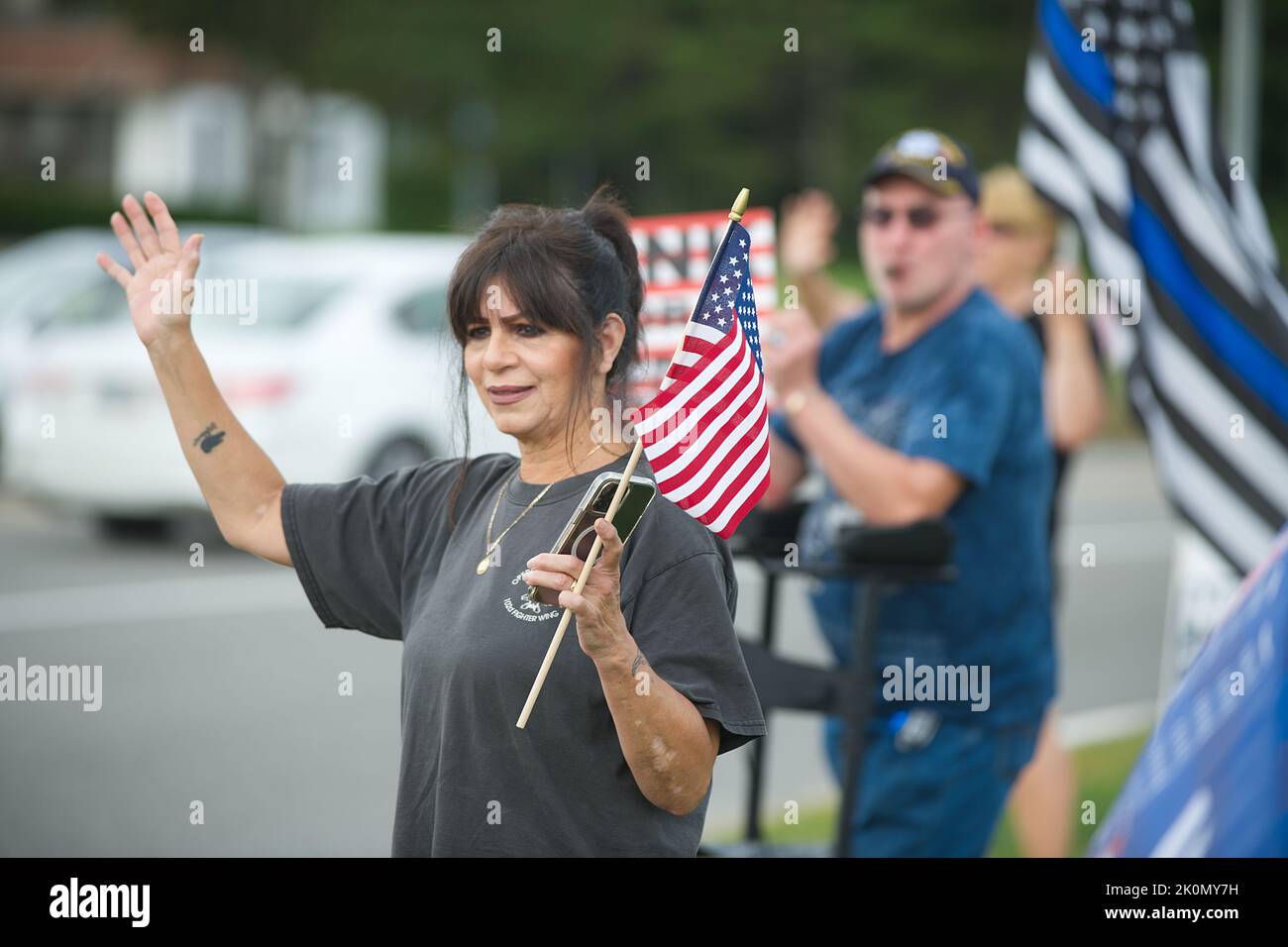 Remembering September 11th - flag waving at the Bourne Rotary on Cape Cod, Massachusetts, USA Stock Photo