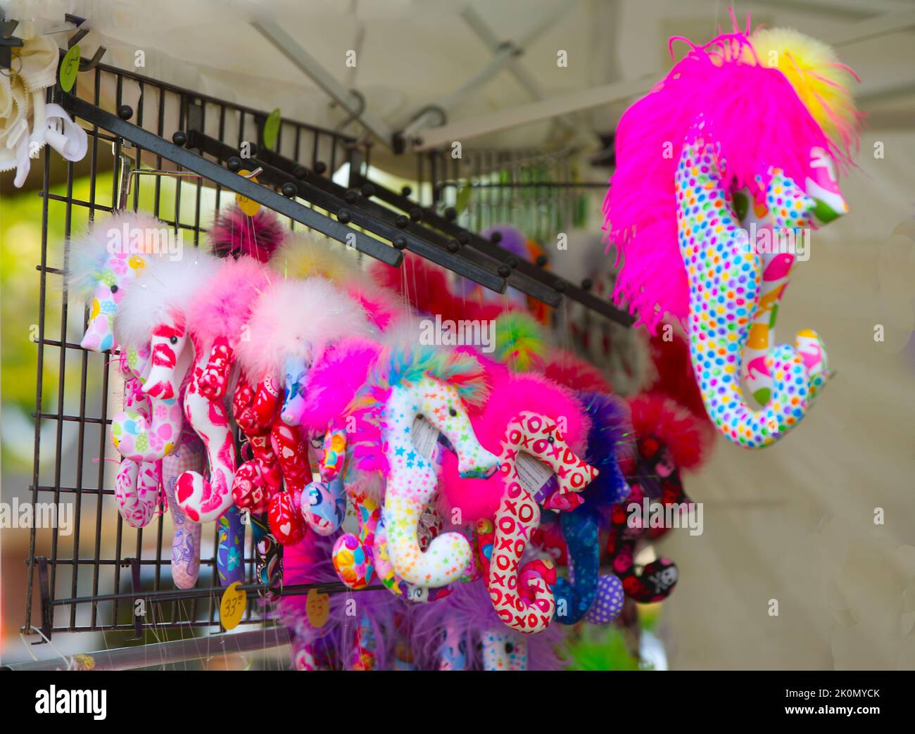 Colorful seahorses hang from a display at the Eastham Windmill Weekend on Cape Cod, USA Stock Photo