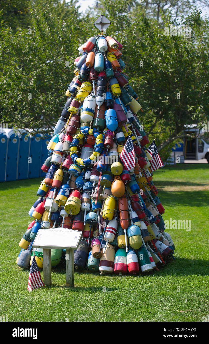 A display of lobster buoys at the Eastham Windmill Weekend fair, on Cape Cod, USA Stock Photo