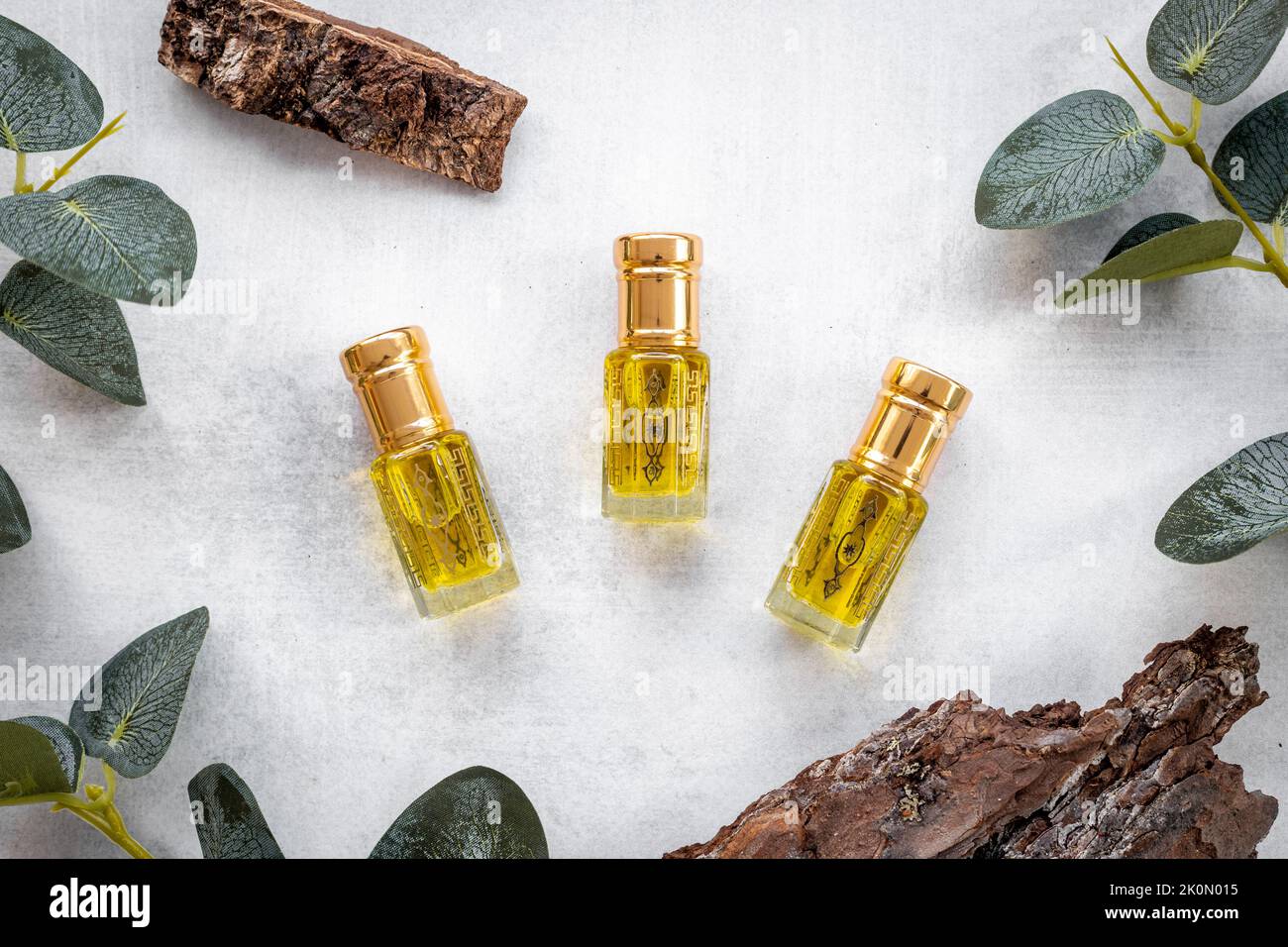 Arabian oud attar oil perfume in glass bottles. Overhead view Stock