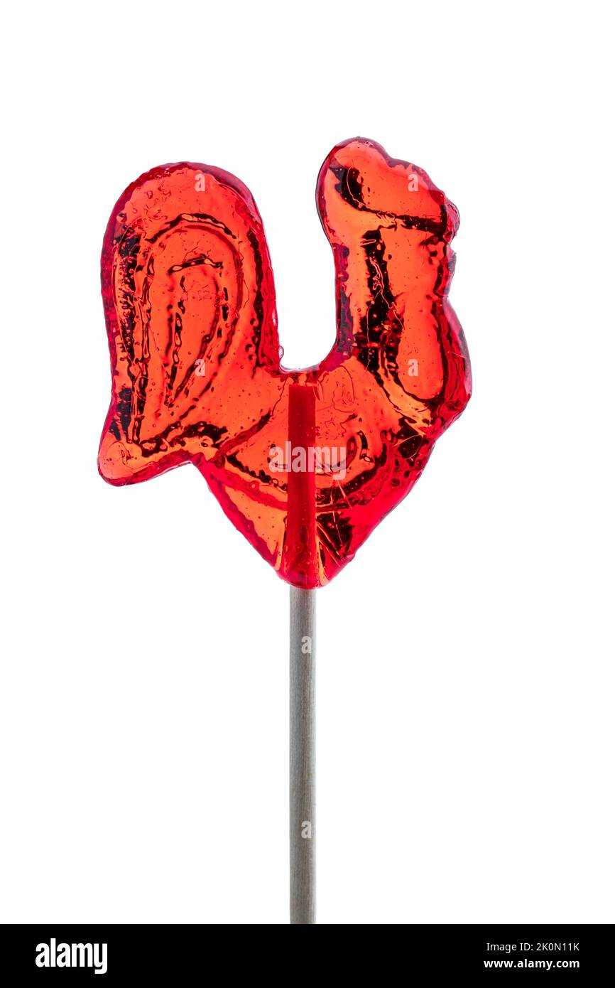 Traditional  hen shape red lollipop on wooden stick isolated Stock Photo