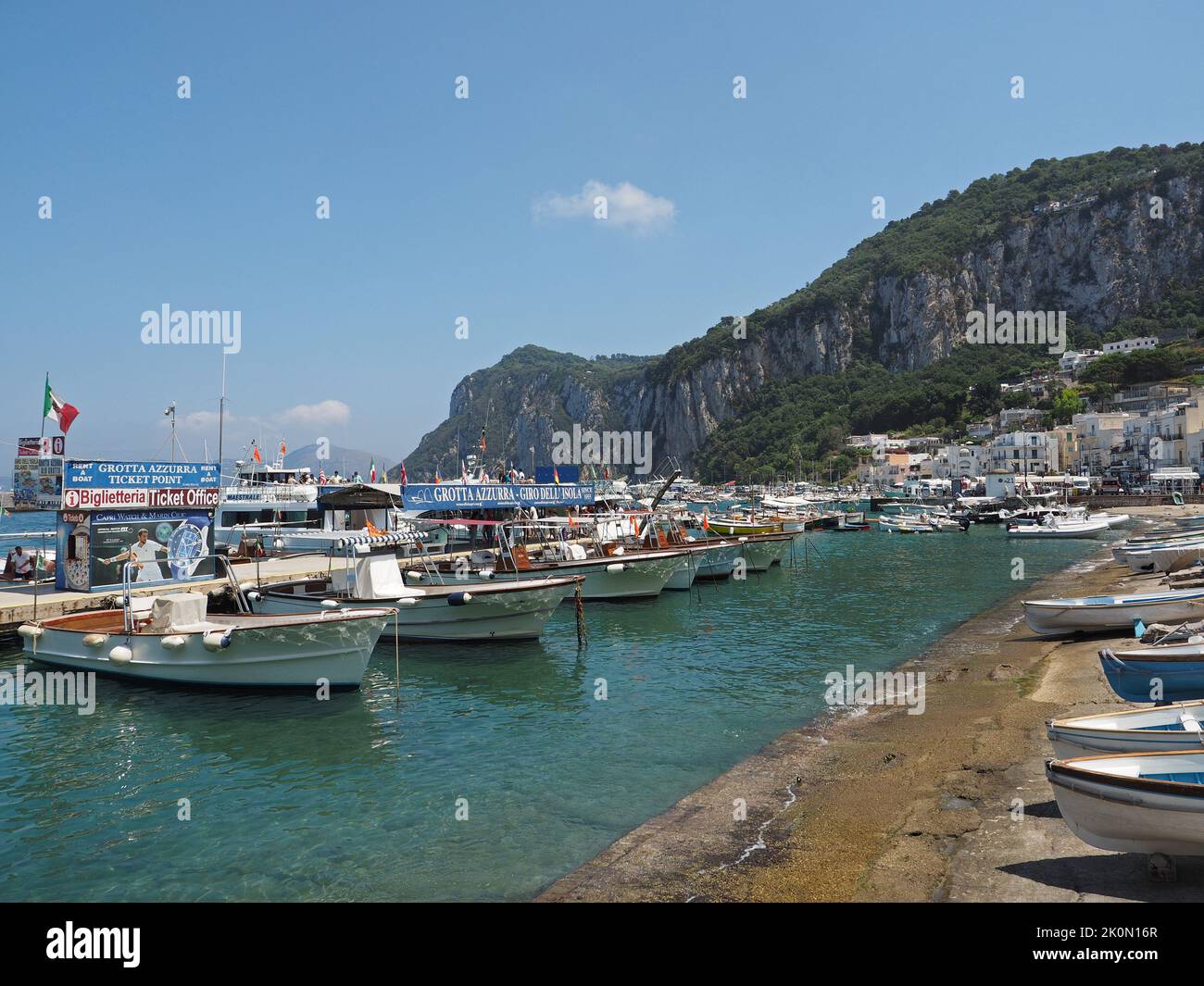 Port of Capri with many tourist boats that are used to visit the grotto azzurro or tour around the island. Capri, Campania, Italy Stock Photo