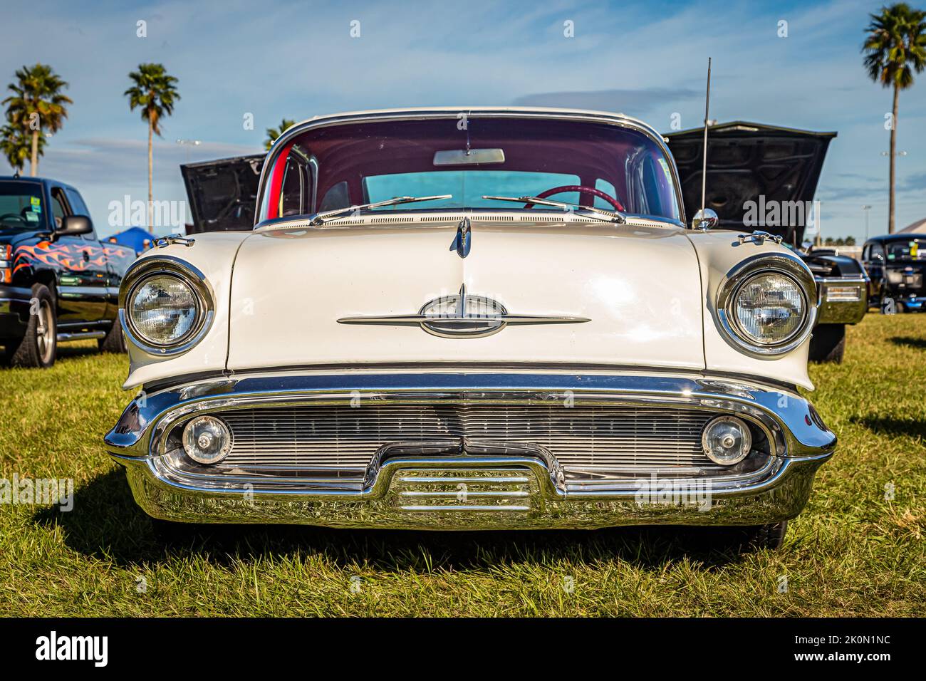 Daytona Beach, FL - November 24, 2018: Low perspective front view of a 1957 Oldsmobile Golden Rocket 88 Holiday Hardtop Coupe at a local car show. Stock Photo