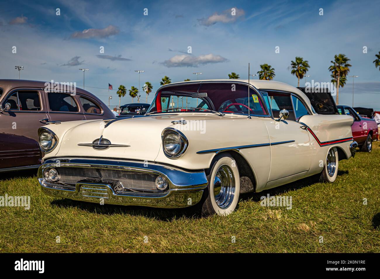 Daytona Beach, FL - November 24, 2018: Low perspective front corner view of a 1957 Oldsmobile Golden Rocket 88 Holiday Hardtop Coupe at a local car sh Stock Photo