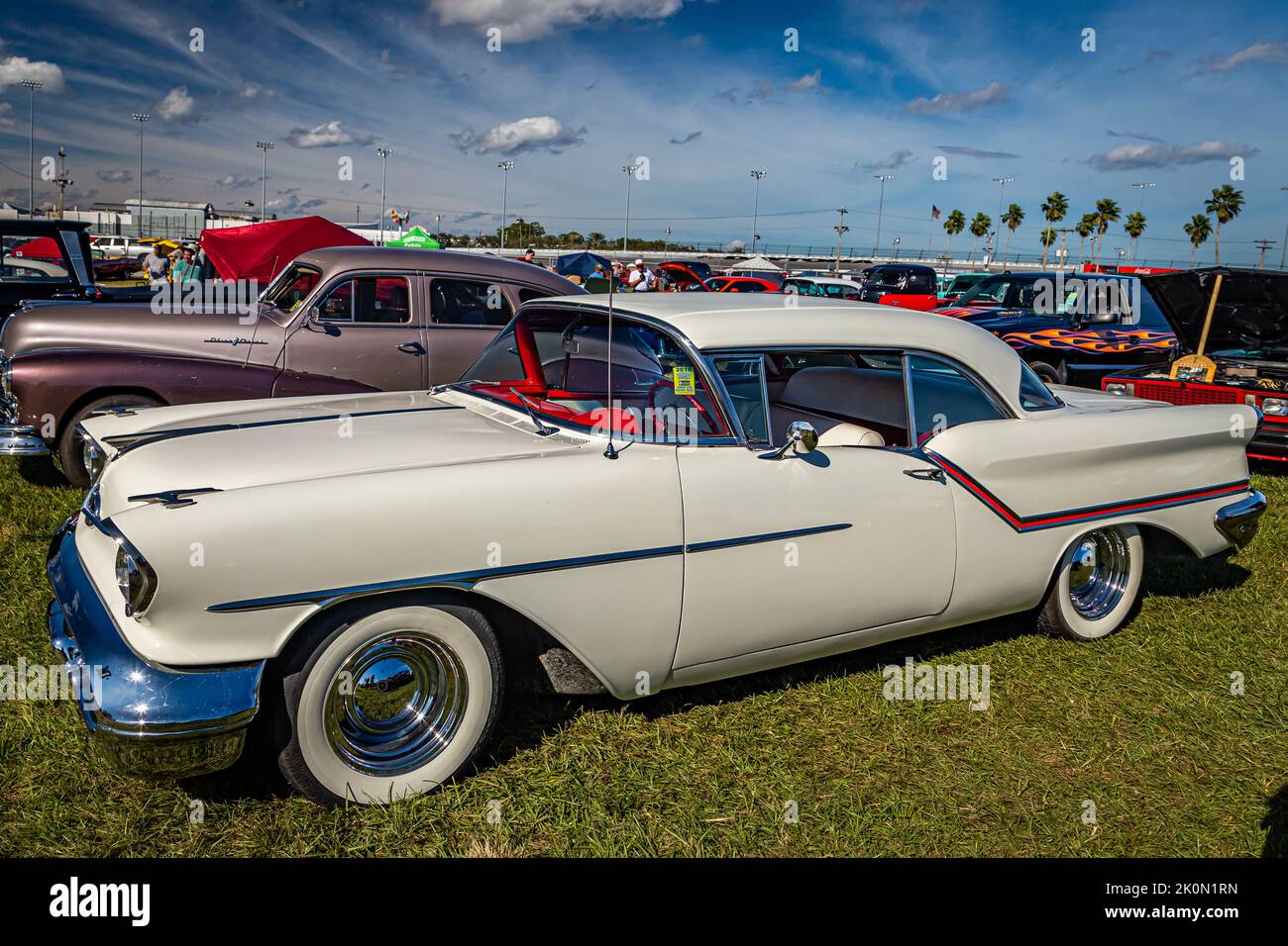 Daytona Beach, FL - November 24, 2018: High perspective side view of a 1957 Oldsmobile Golden Rocket 88 Holiday Hardtop Coupe at a local car show. Stock Photo