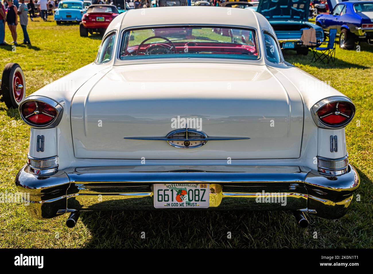 Daytona Beach, FL - November 24, 2018: High perspective rear view of a 1957 Oldsmobile Golden Rocket 88 Holiday Hardtop Coupe at a local car show. Stock Photo