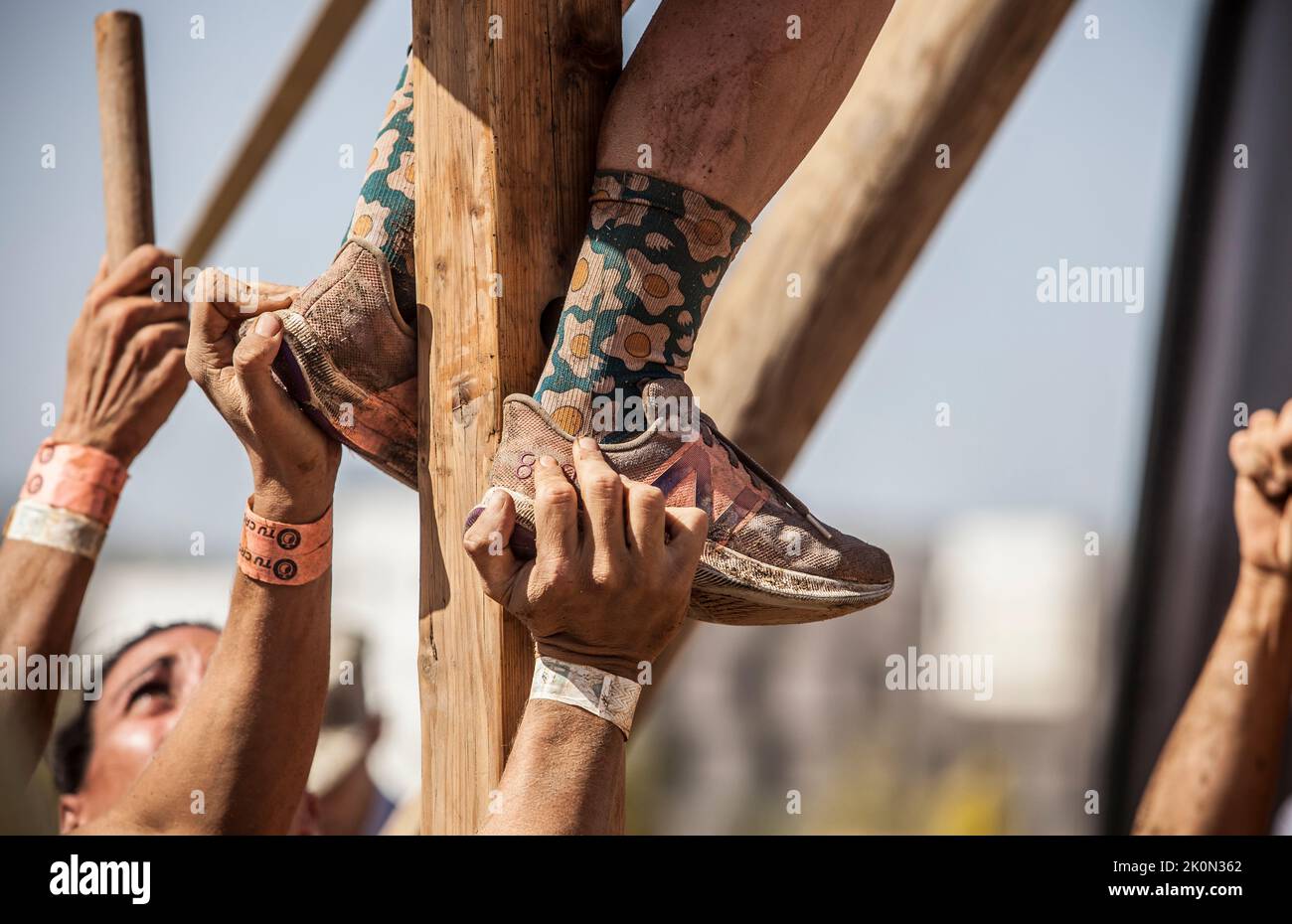 Merida, Spain - Sept 11th, 2022: FarinatoRace Merida 2022. Teammates helping to climbing pole Stock Photo