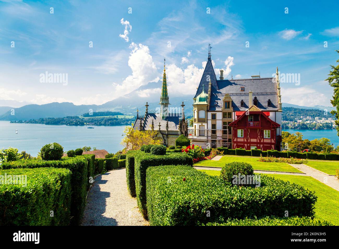 19th century Meggenhorn Castle overlookig Lake Lucerne and the Alps, Meggen, Switzerland Stock Photo