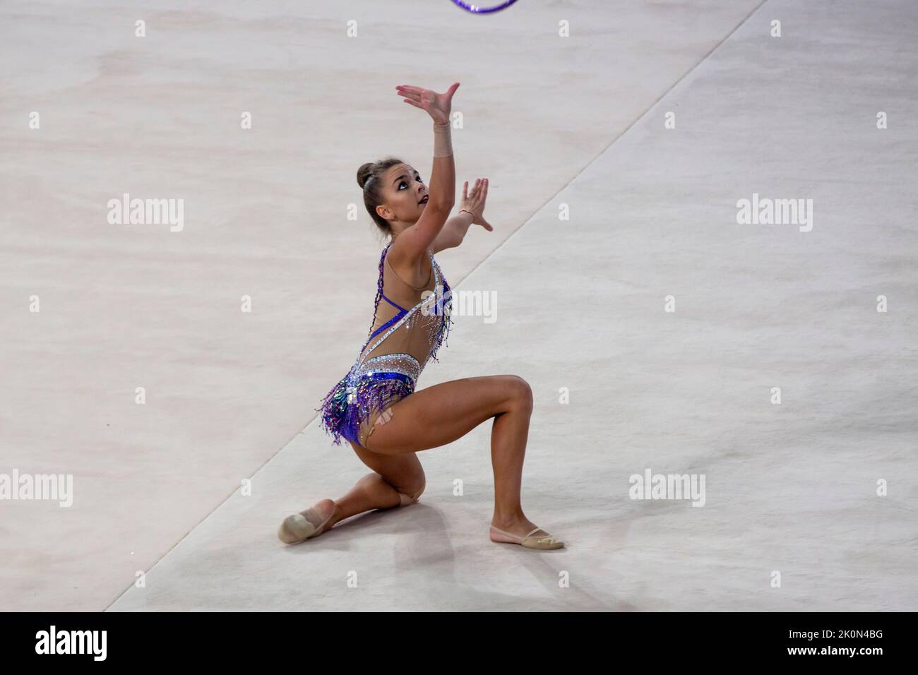 Moscow, Russia. 12th of September, 2022. Dina Averina performs her hoop routine in a qualification at the 2022 All-Russian Summer Spartakiad in Rhythmic Gymnastics at Irina Viner-Usmanova Gymnastics Palace in Luzhniki in Moscow, Russia. Nikolay Vinokurov/Alamy Live News Stock Photo