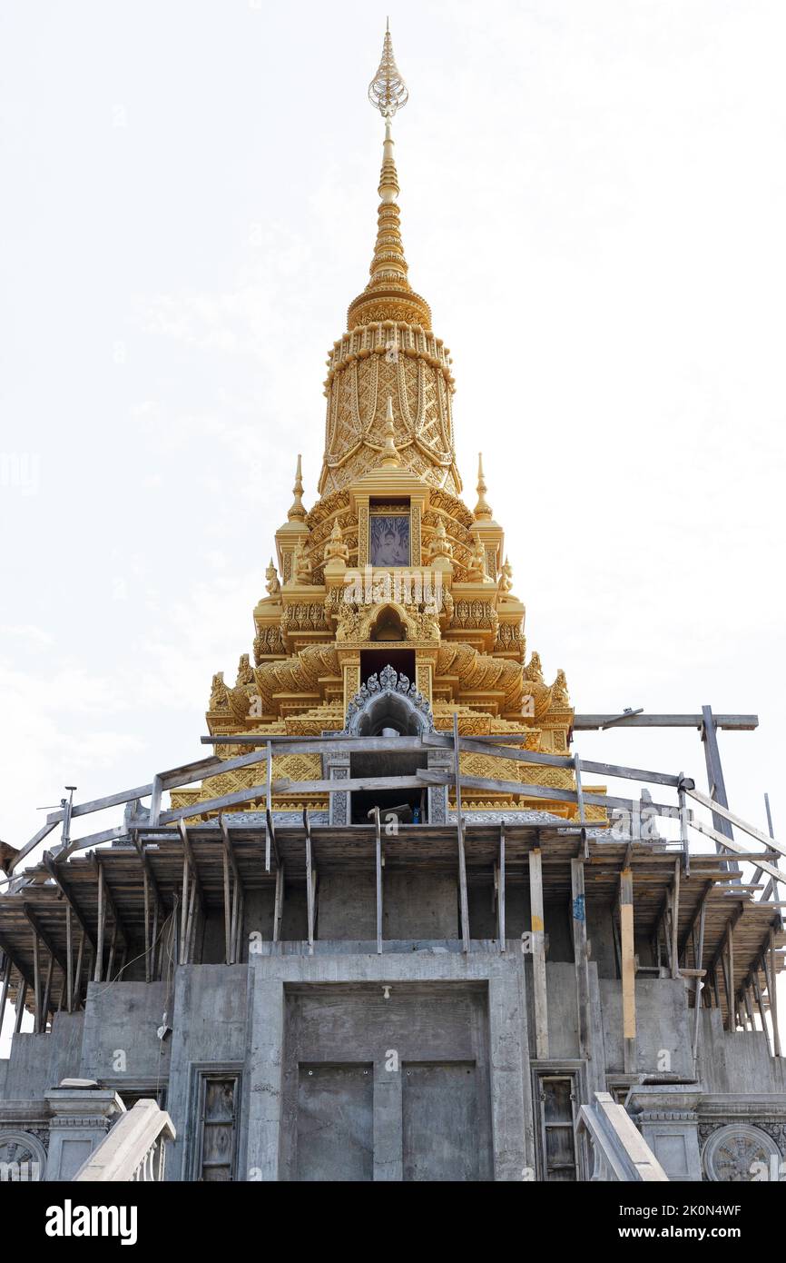 A partially finished temple with gold spire under construction at Watt Munisotaram Cambodian Buddhist Monastery in Hampton, Minnesota. Stock Photo